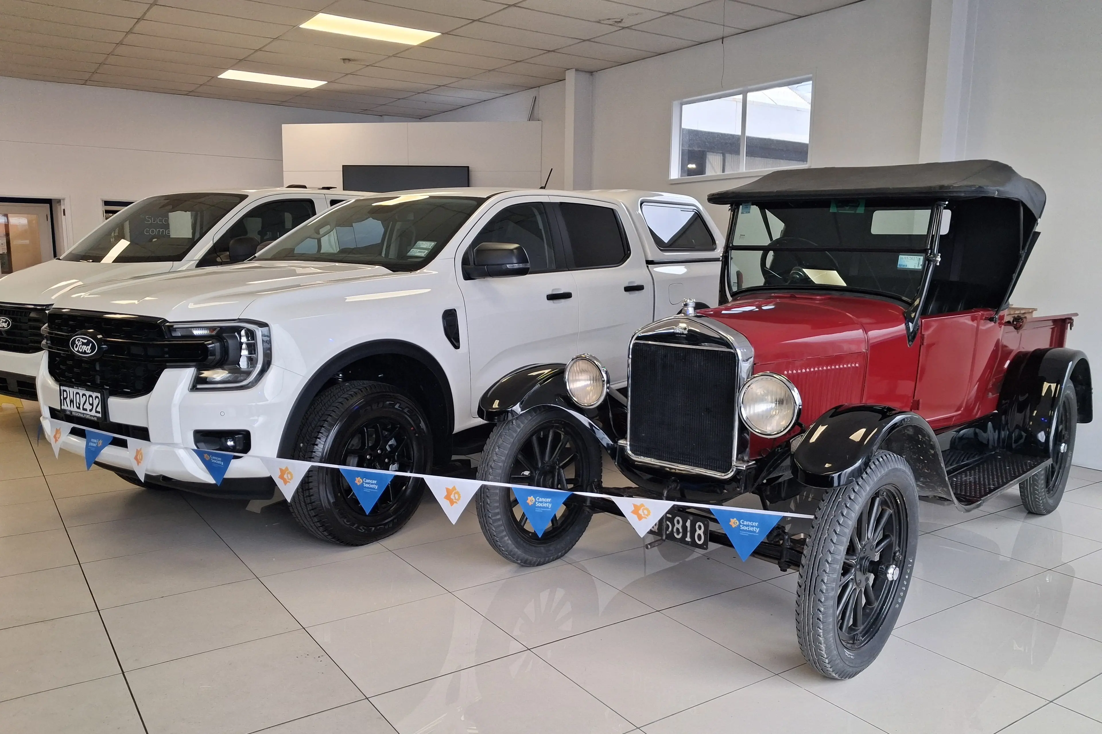 A 1926 Ford ute sits proudly next to a 2026 Ford ute at Regional Ford Gore ahead of the Gore Daffodil Day Rally for Cancer. Photo. Supplied.