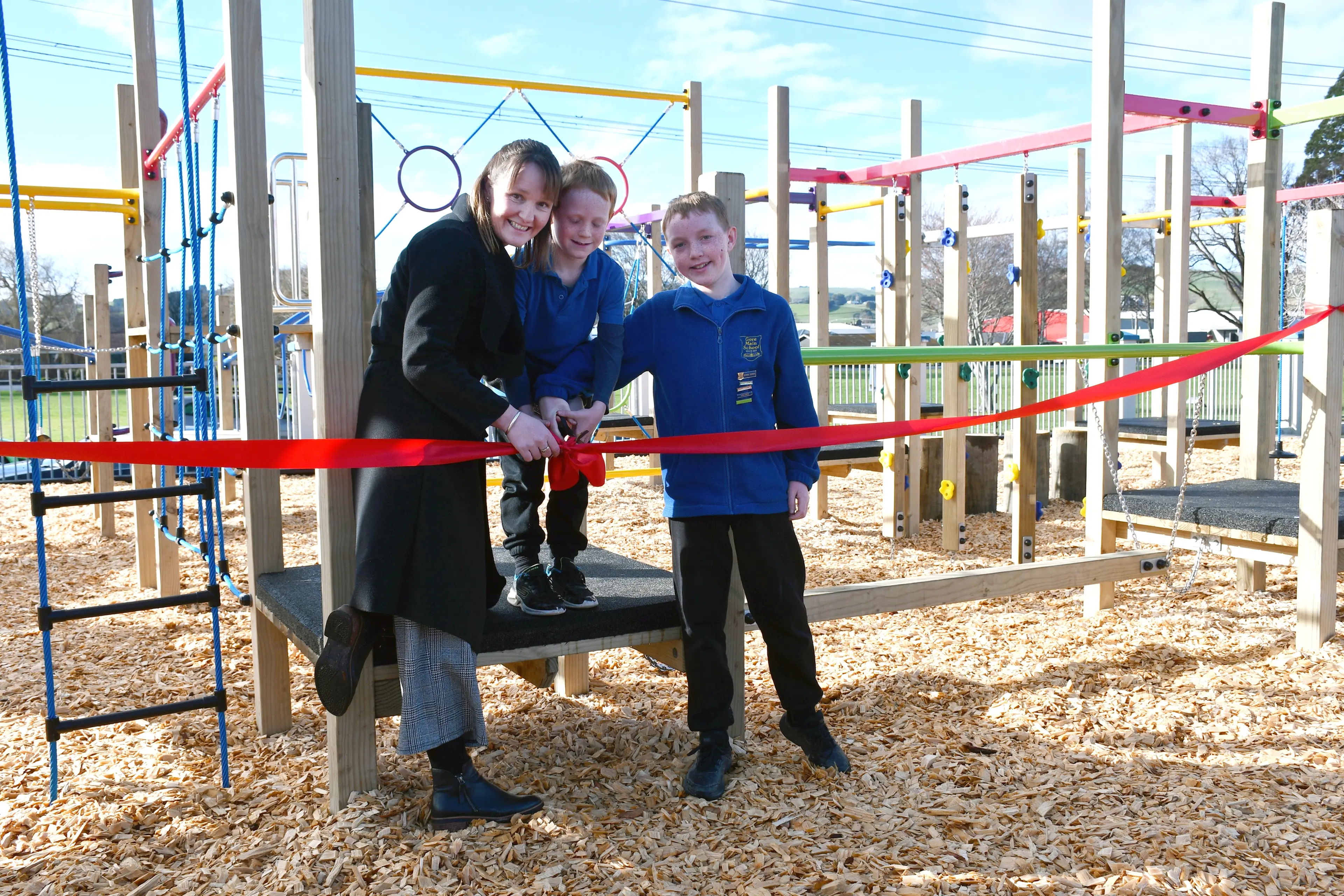 Gore Main School PTA president Trudie South, with her two sons Caleb, 7, and Toby Brown, 11, officially open the school\\'s new playground that took six figures, and over a year to complete, on Monday. Photo: Gemma Sinclair