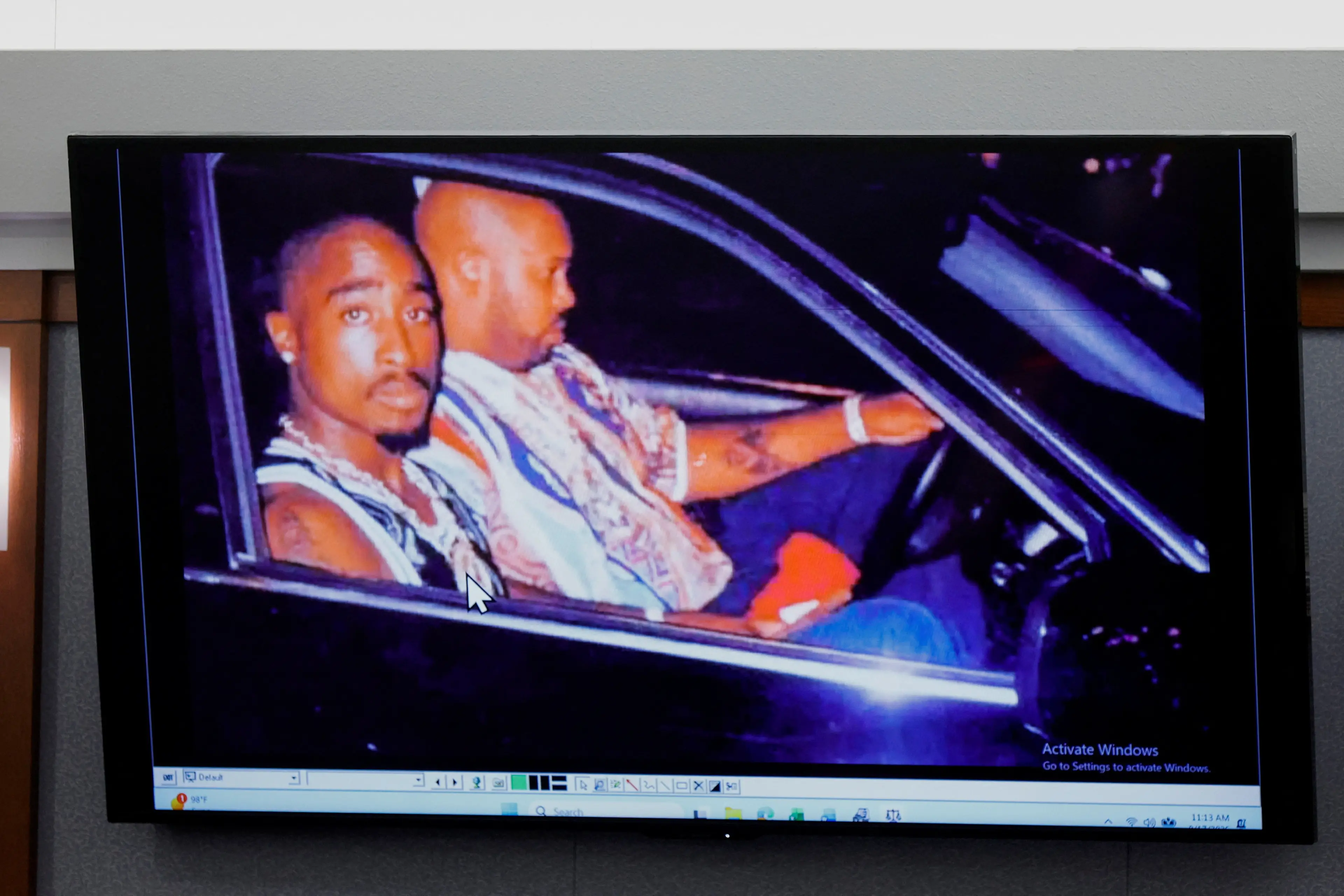 <p>A 1996 photo of rapper Tupac Shakur (L) and Marion "Suge" Knight is displayed during the Duane Davis murder trial, related to the 1996 killing of the rapper, at Clark County District Court Regional Justice Center in Las Vegas, Nevada. Photo: Reuters / Pool</p>\\n