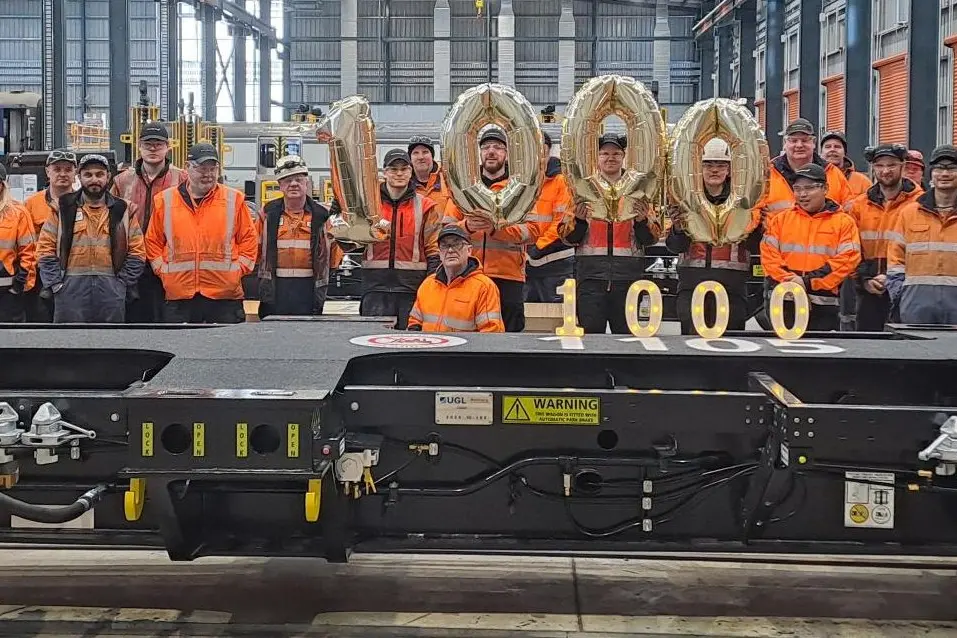 The KiwiRail crew who assembled the 1000th wagon of a build of 1350 at Hillside railway workshop. Photo: supplied