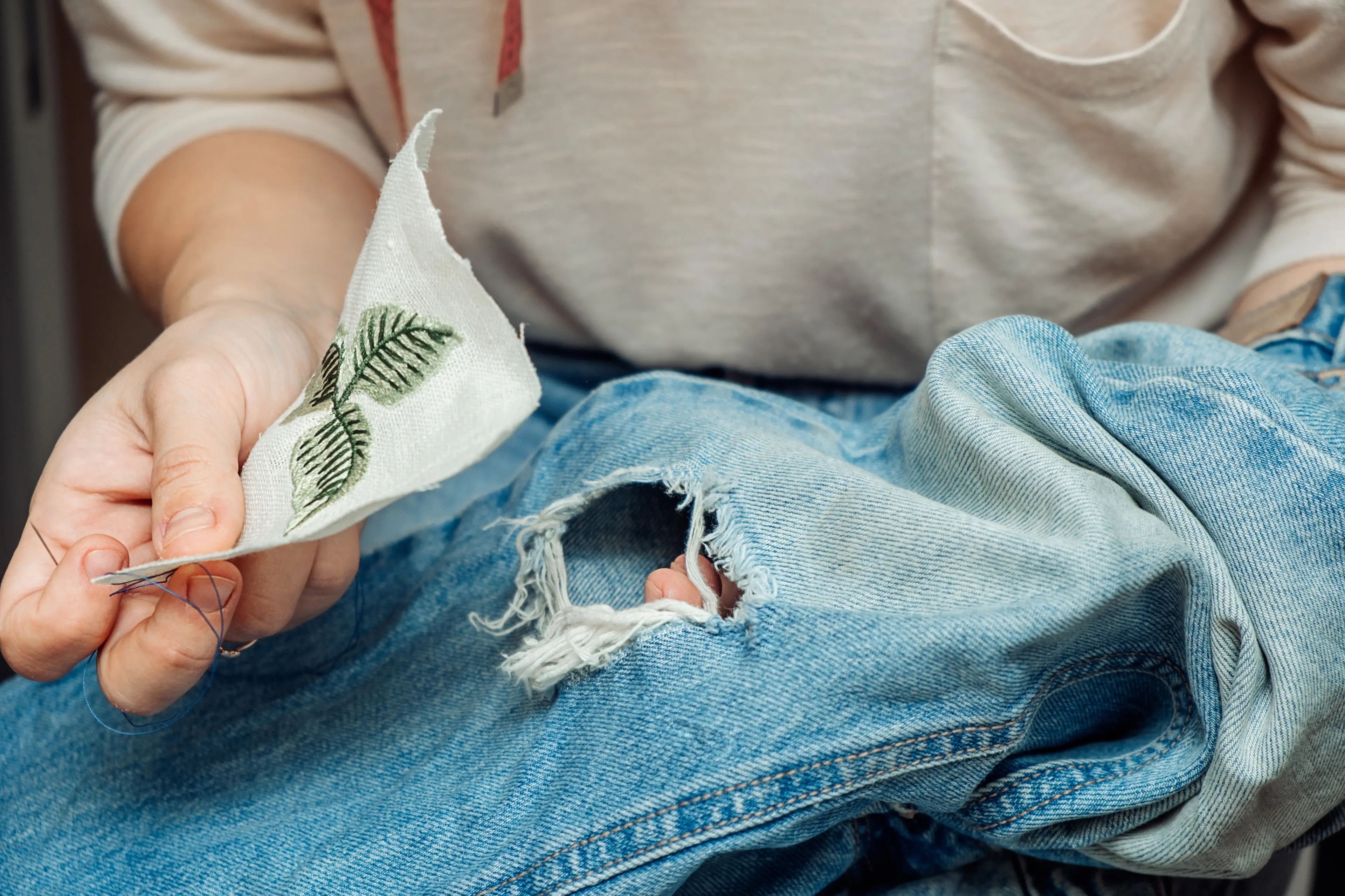 Mending clothes can extend their life. Photo: Getty