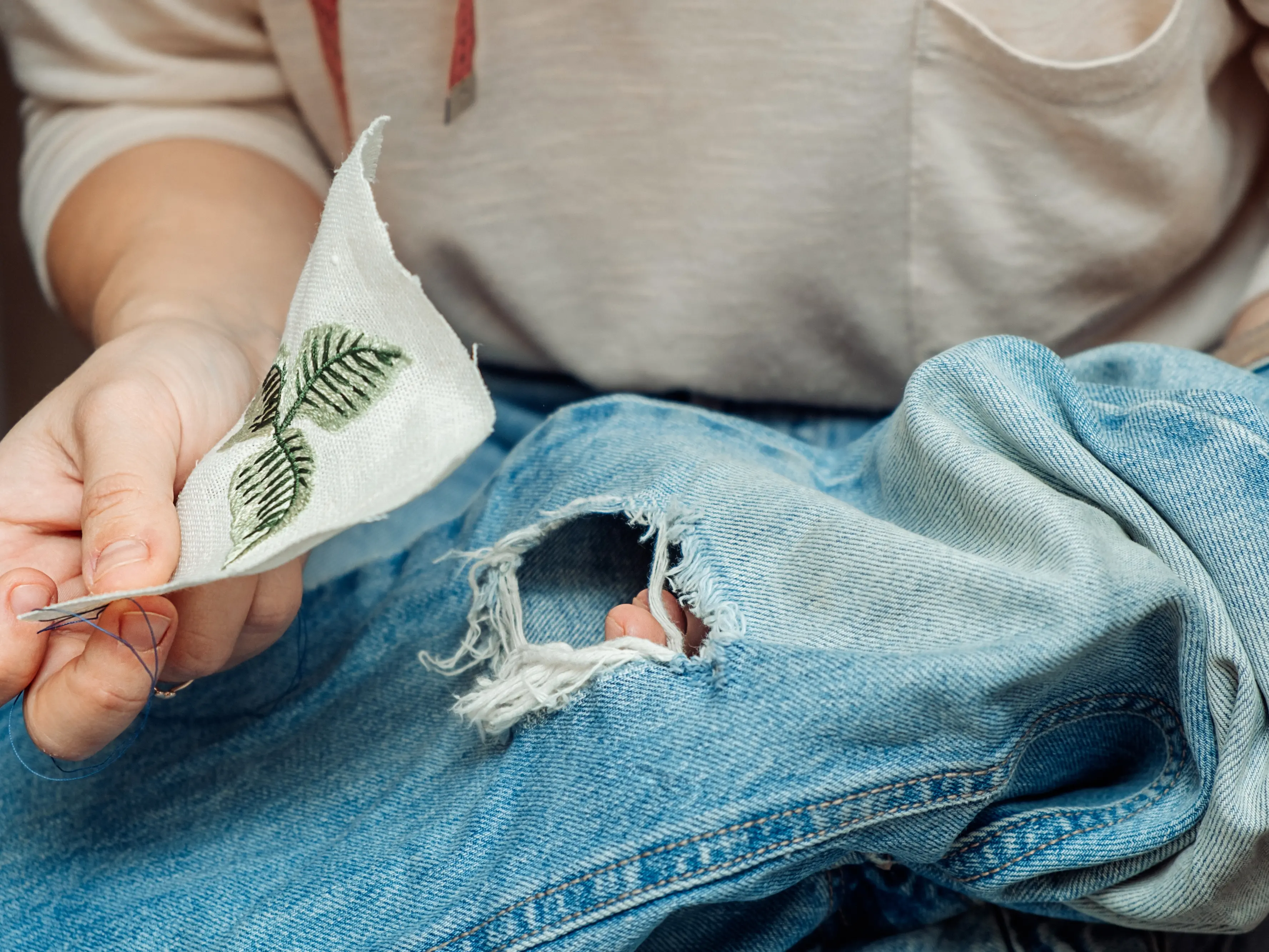 Mending clothes can extend their life. Photo: Getty