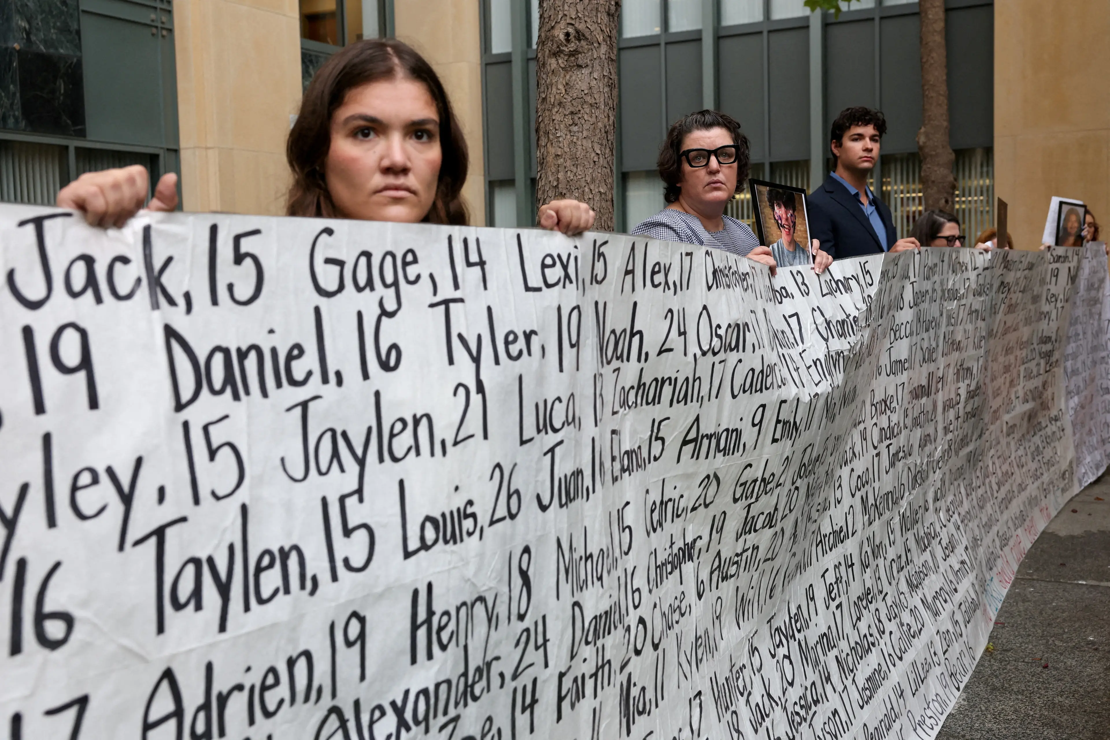 People hold a picture and a placard with names of young people, as parents of children and young adults whose deaths were allegedly related to social media use hold a press conference, as Meta faces a landmark trial in federal court over claims from 29 states. Photo: Reuters