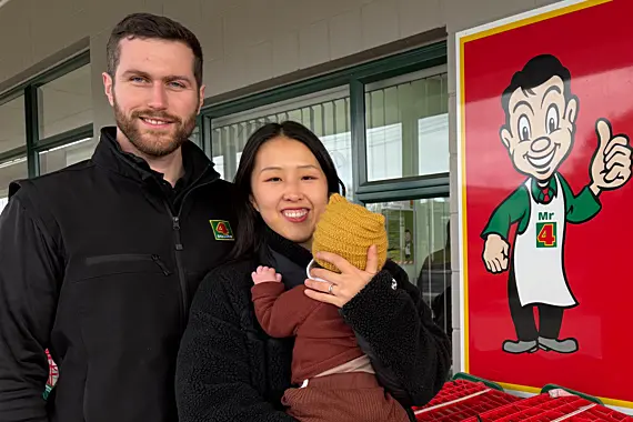 Fresh in to the Owaka Four Square supermarket is new owner Will Thomson, accompanied by wife Tae and baby son Ian. Photo: Supplied