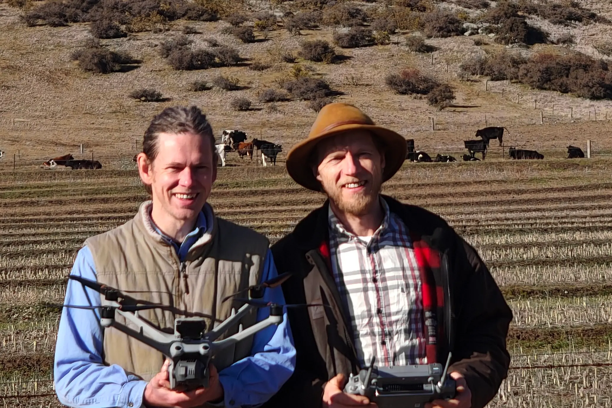 AgRhythm co-founders Henry Boyle (left) and Tim Jacobsen with a drone and controller on-farm. Photo: AgRhythm