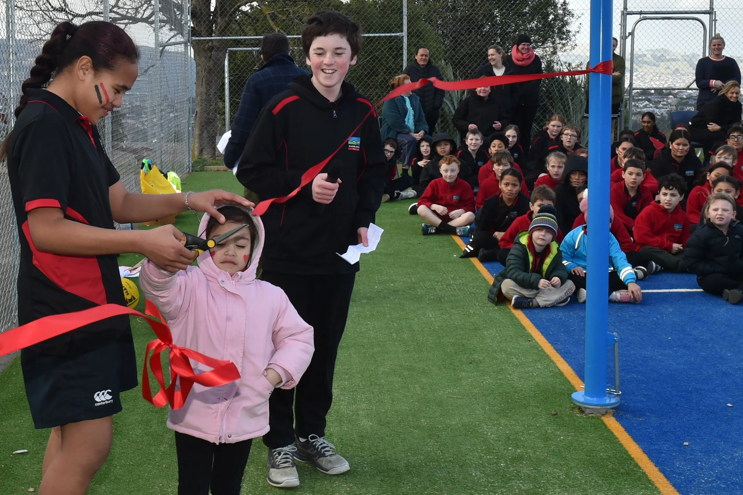 Opening the new sports court at Brockville School are pupils (from left) Daphne Laban, 13, Aurora-May Hapi-Awatere, 5, and Eli Davies, 12. Photo: Gregor Richardson