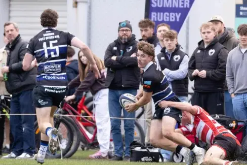 Sumner wing Cormack Tarrant looks to offload to fullback Seb Cox against Burnside in a game earlier this year. Photo: Tony Brunt Photography