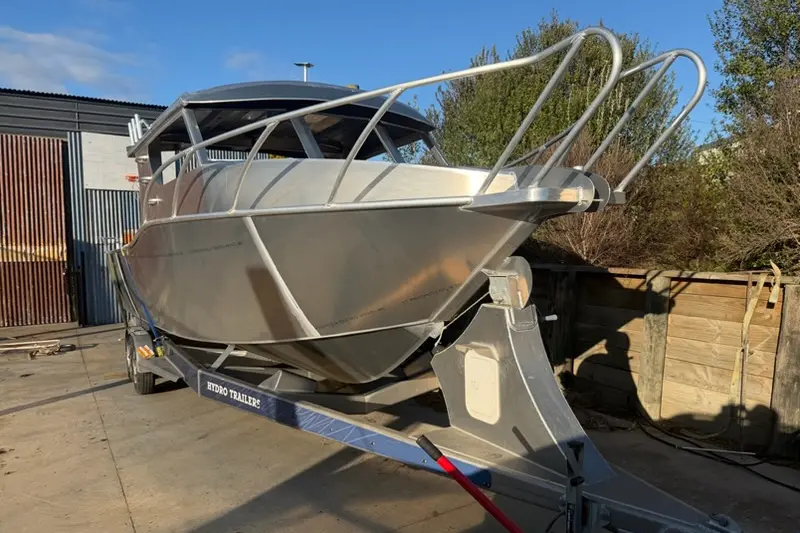 Wade Meyer, of \\u014Cp\\u014Dtiki, said he went to pick up his boat from Alexandra-based Hydro Marine Limited to find it unfinished and welded to his trailer two years after ordering it. Photo: Supplied
