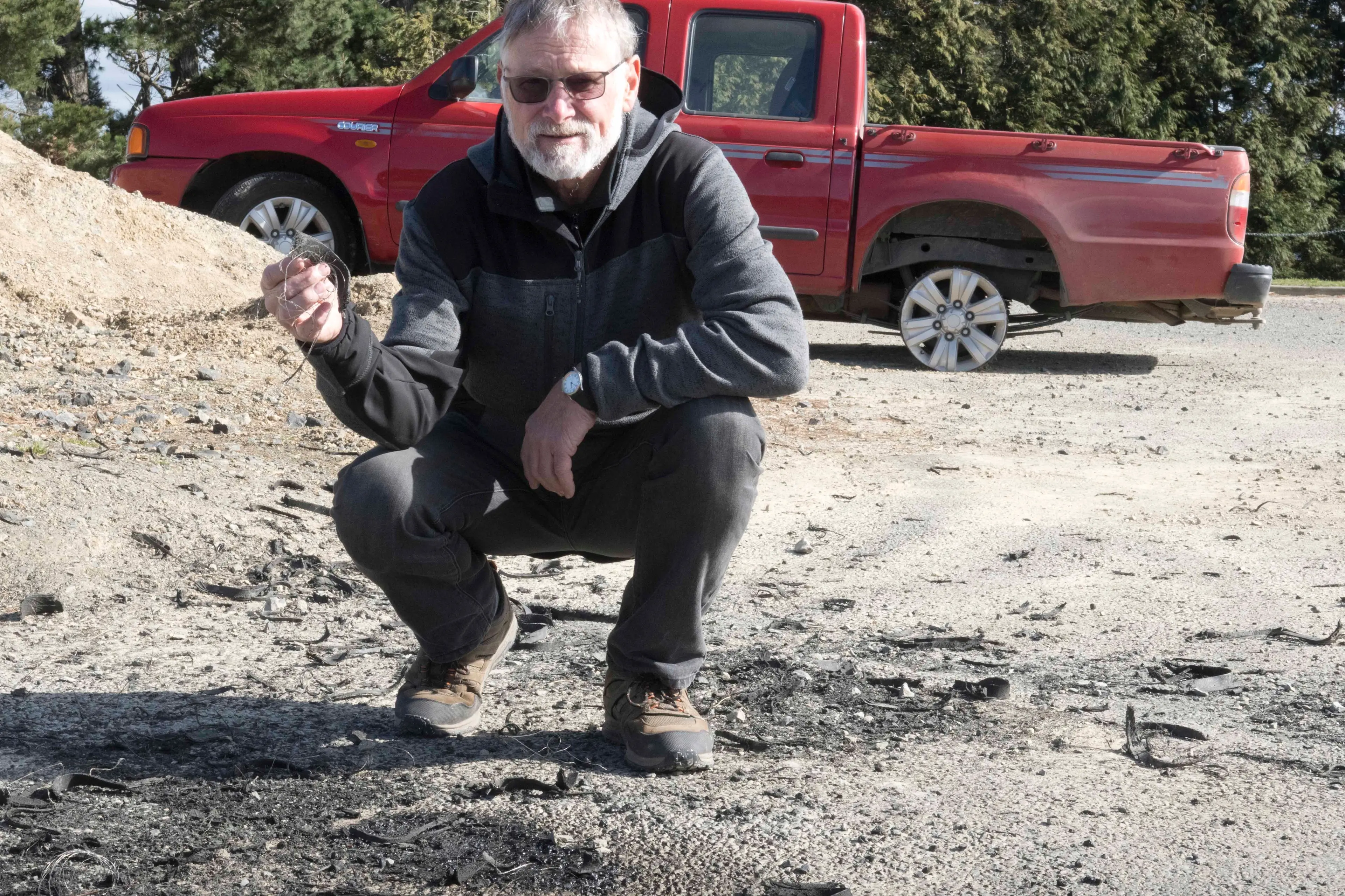 Highcliff resident Barry Oats is frustrated by unruly behaviour at Rotary Park. The stolen ute behind him was run until the tyres shredded. Photo: Gerard O\\'Brien