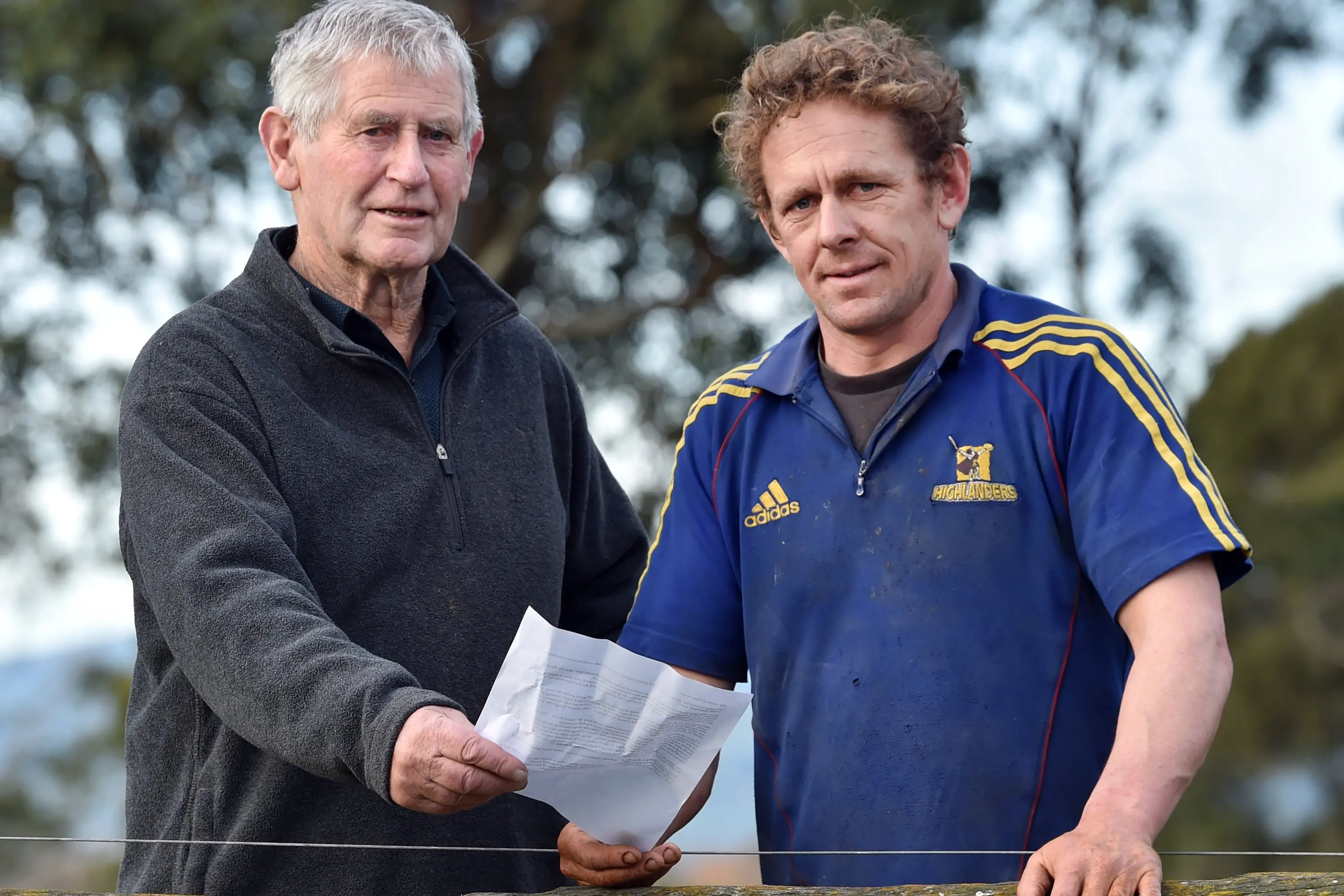 Farmers Alan Scurr (left) and Cody Cowley at their property in Gladstone Rd. Photo: Peter McIntosh