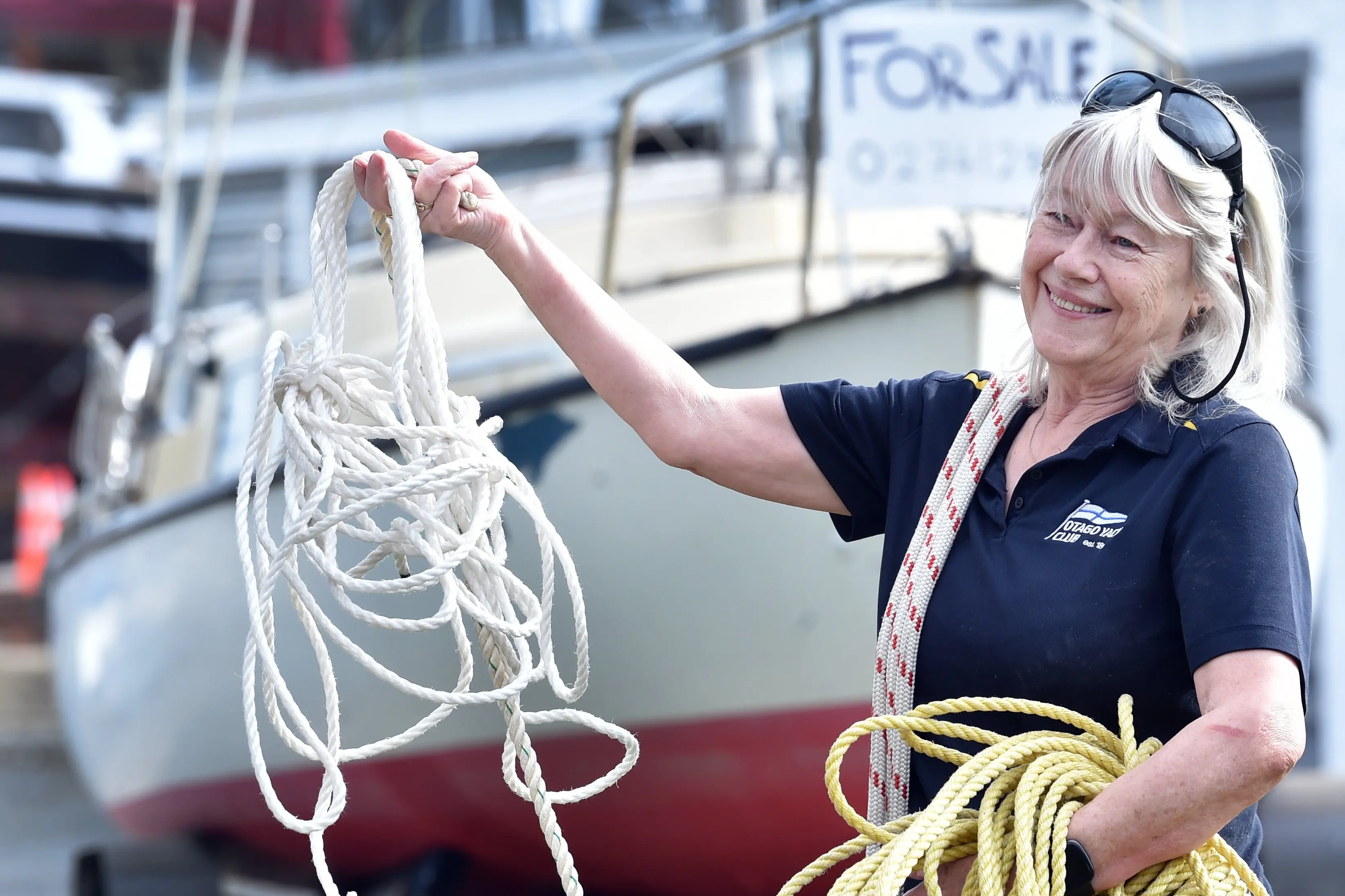 Otago Yacht Club committee member Ann Flamank holds some fore sale ropes at the Otago Yacht Club\\'s Jumble Sale on Saturday. Photo: Peter McIntosh