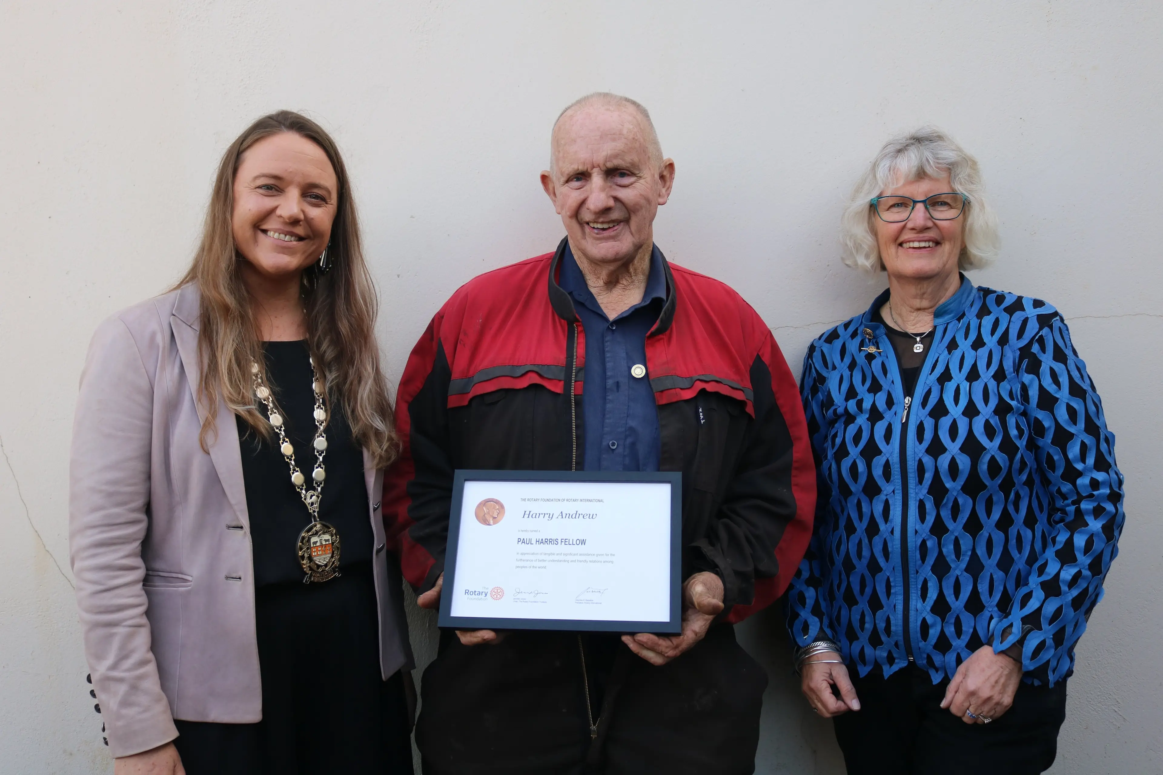 Waitaki District Mayor Mel Tavendale (left) and Rotary Club of Oamaru president Ele Ludemann present Oamaru Steam and Rail society general manager Harry Andrew with the Paul Harris Fellow Award. Photo: Jules Chin