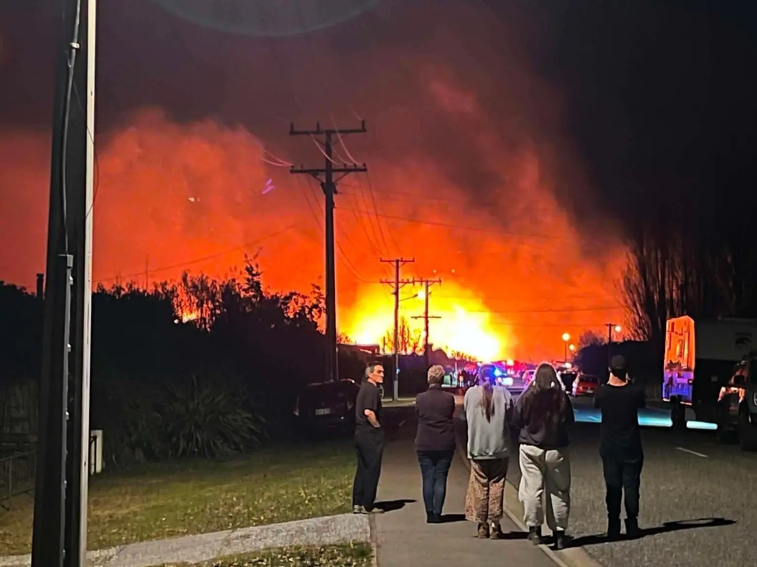 Houses evacuated as firefighters battle large Albert Town fire