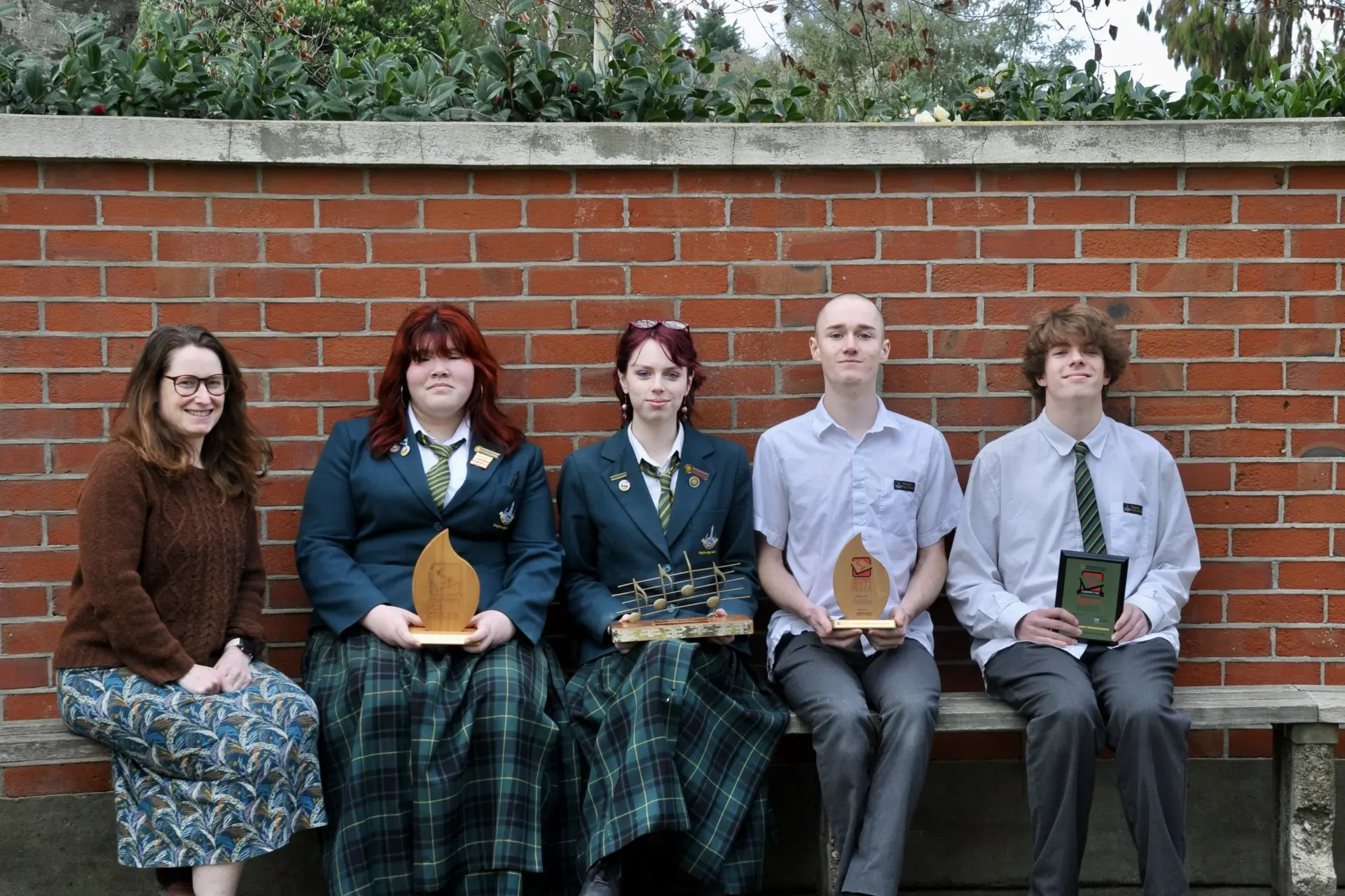 Celebrating musical success... Rangiora High School\\u2019s head of music and creative arts, Sophia Bidwell with members of  the school\\u2019s Jazz Combo, Ella Patterson, aged 15, Lola Halliwell, aged 18, Caleb Bell , aged 17 and Louis Hector, aged 16. The group won the Supreme Overall Winner Award, and other awards, at the annual Southern Jam Jazz Youth Festival in Blenheim earlier this month.  Band leader Ollie Read, aged 17, was absent for the photo. PHOTO: SHELLEY TOPP