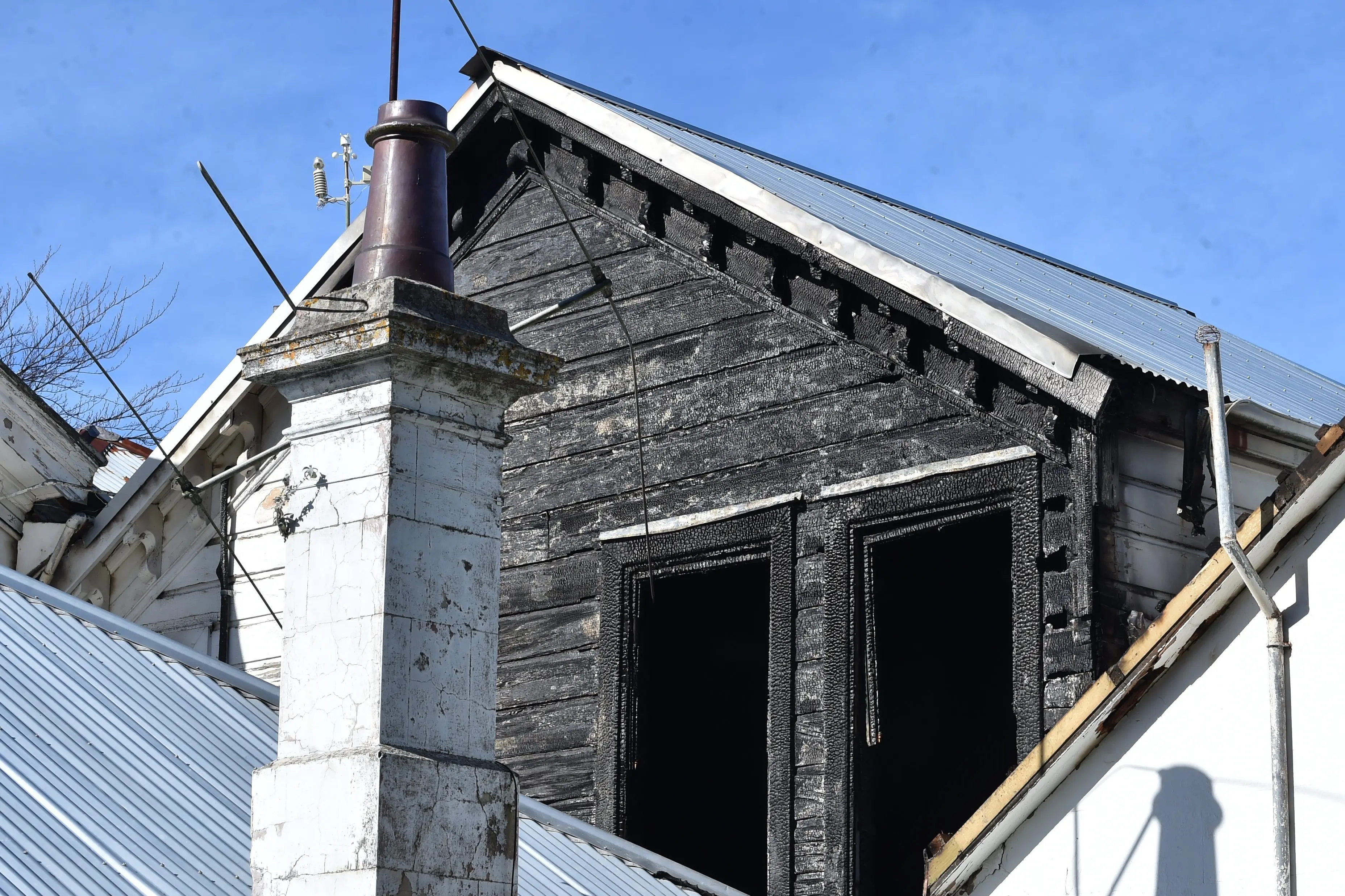 A fire-damaged window in Melville Hall, Melville St, after a fire broke out on Sunday night. Photo: Peter McIntosh