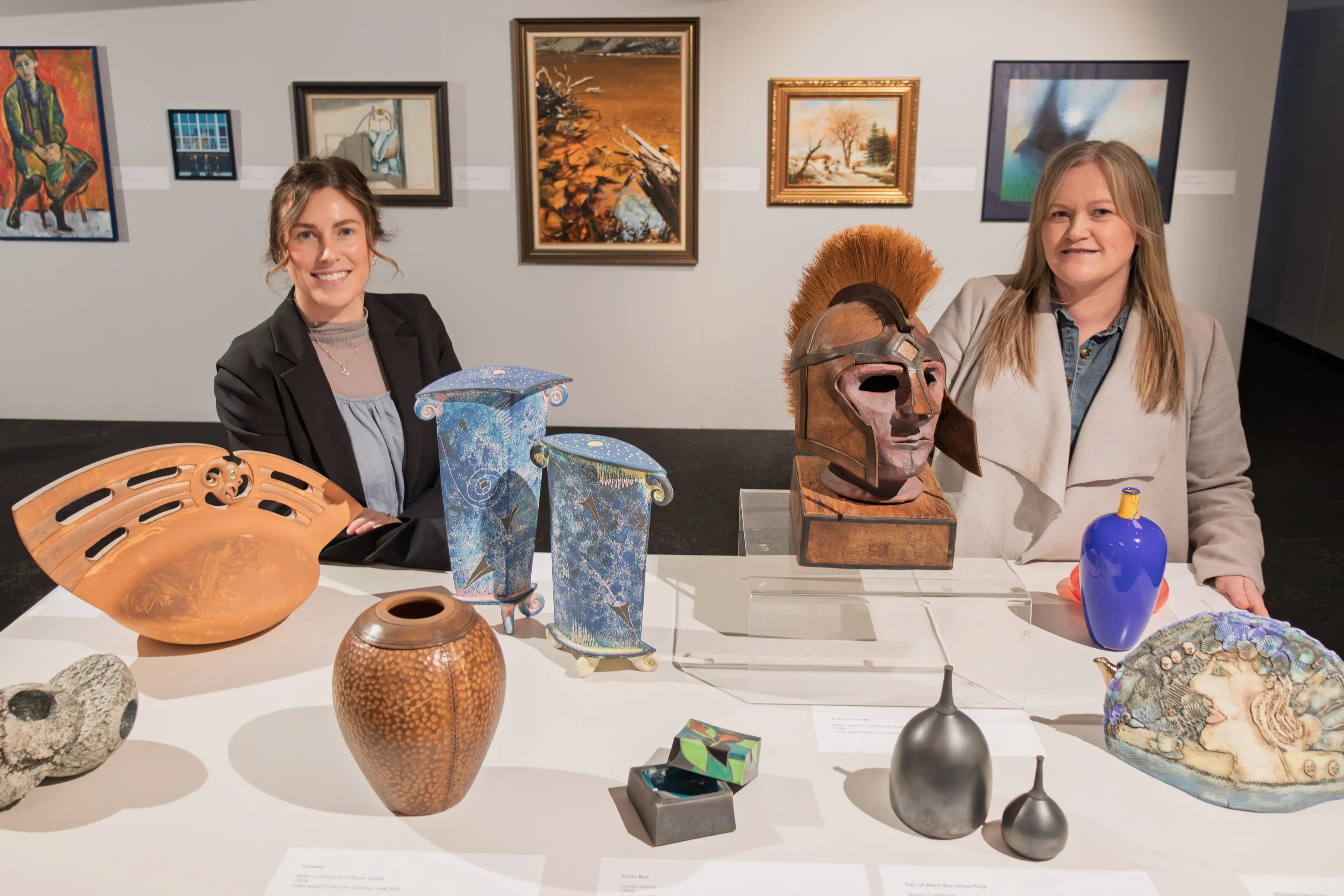 He Waka Tuia senior curator exhibitions Gemma McDonald and manager Sarah Brown with\\nsome of the works in the Spring: What We\\u2019ve Kept exhibition. Photo: SUPPLIED