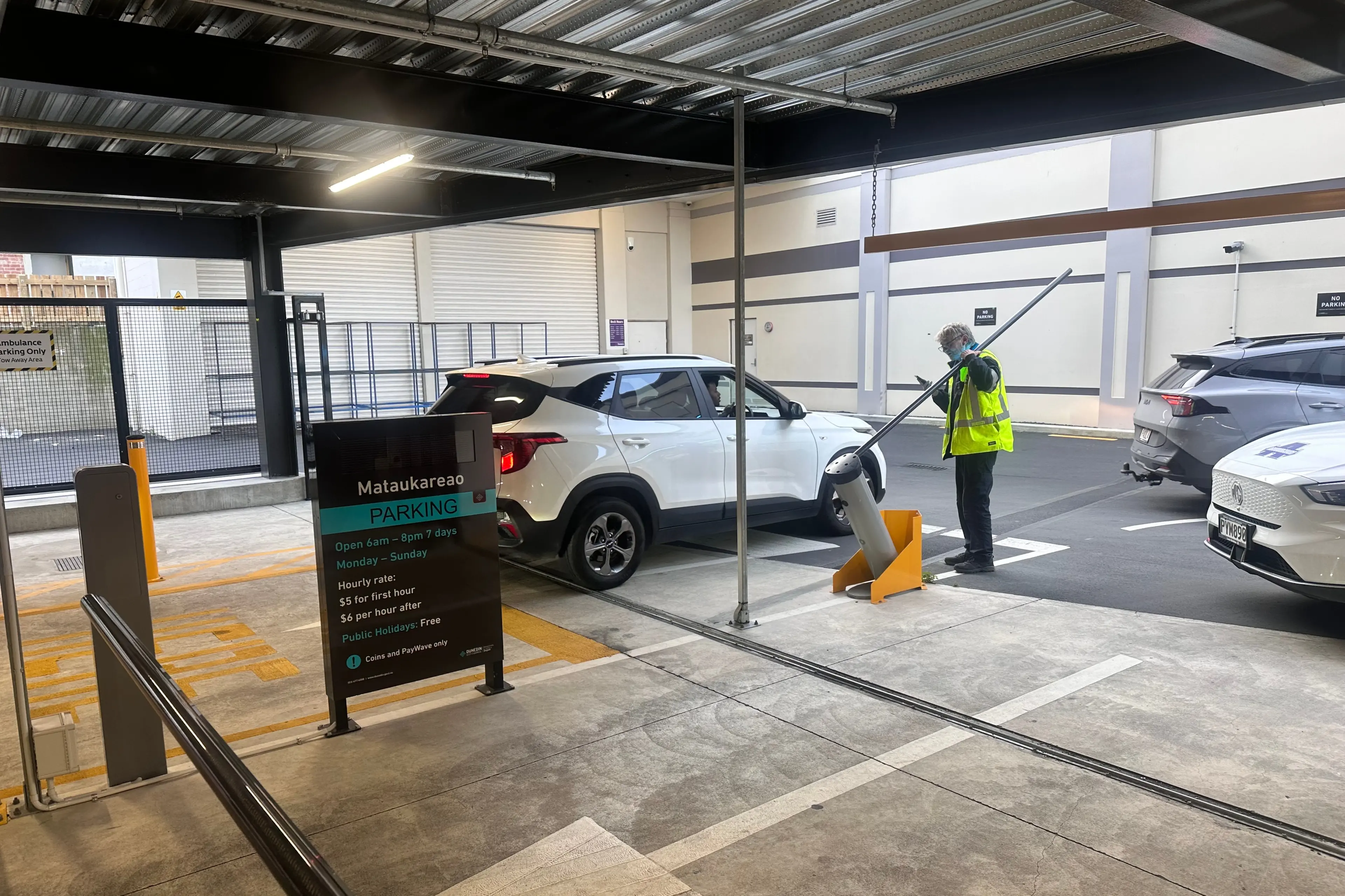 Manual intervention was required to enable vehicles to leave a carpark in Great King St, Dunedin, on Saturday afternoon. Photo: Laine Priestley