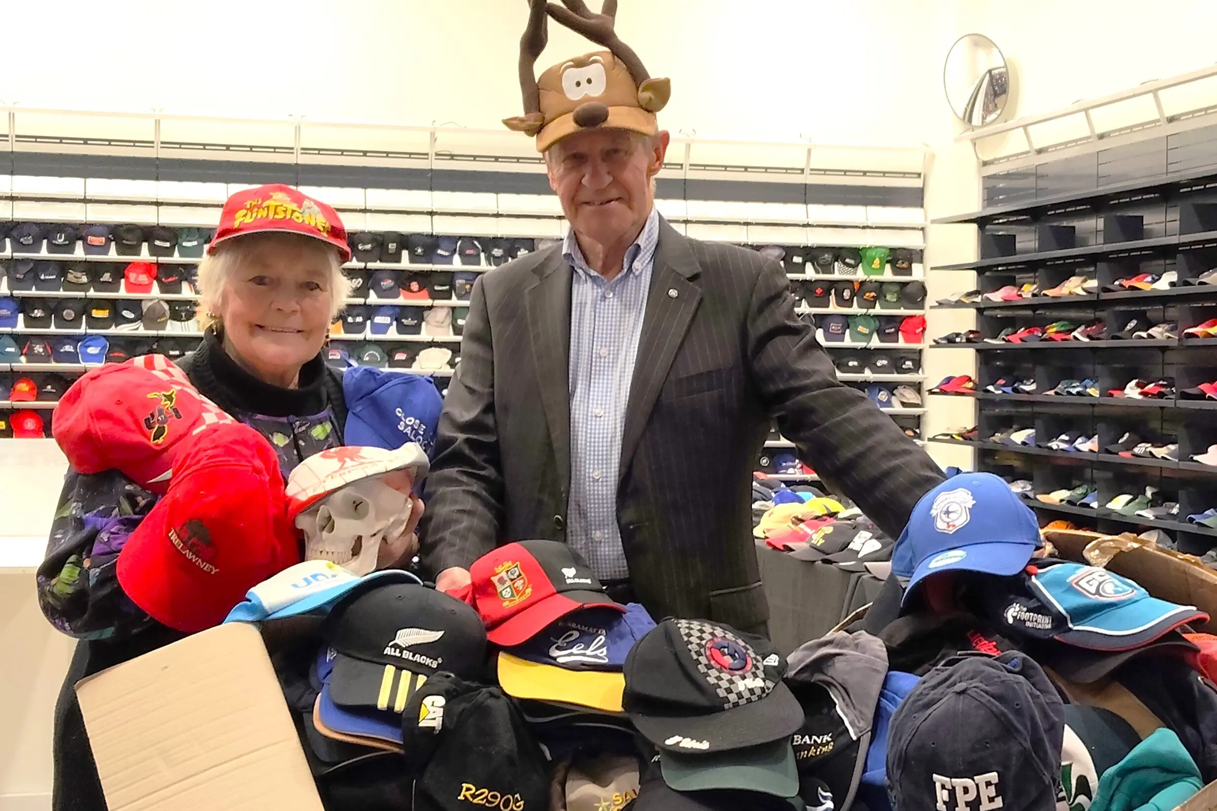 Head Injury Southland Charity Trust field officer Miranda Kennedy and Rotary Club of Invercargill booksale chairman Richard Russell have been toiling away at the Invercargill Central Pop-Up Shop to prepare the display of 13,000 caps to go on sale on Saturday and Sunday.  Photo: Toni McDonald