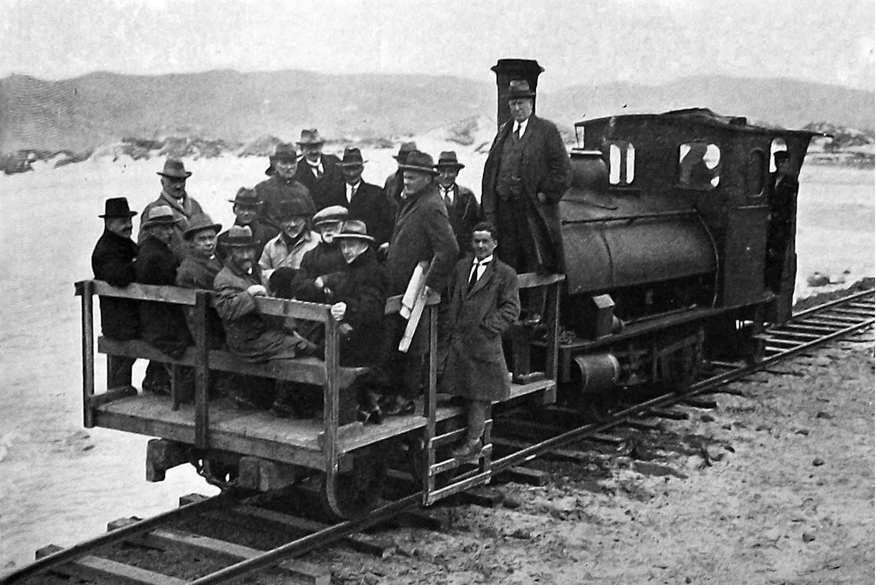 Members of the Otago Harbour Board inspect preparatory work for rebuilding the Aramoana mole, which at the time had a small railway for moving construction material. Photo: <i>Otago Witness</i>, issue 3787, October 12, 1926, page 41