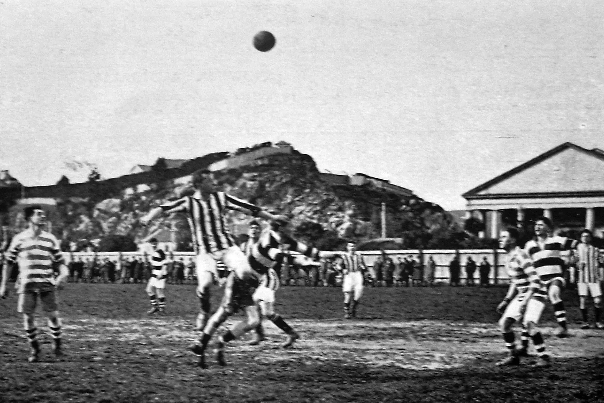 Kaitangata player Rarity heads the ball in an association football Chinese Charity Cup match, Kaitangata v Northern, on October 2, 1926 at Culling Park, Dunedin. The 2-2 tie was won by Kaitangata (vertical stripes), awarded the win for its two corners in extra time under then-current tiebreaking rules. <i>Otago Witness</i>, issue 3787, 12 October 1926, page 43