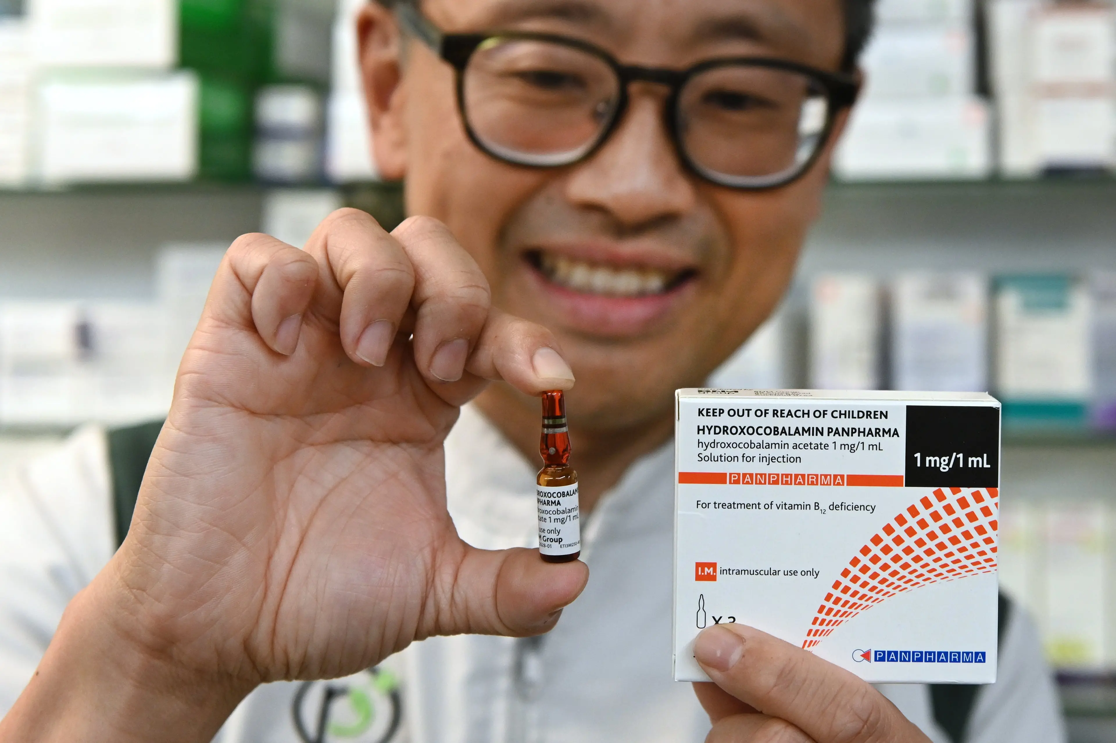Pharmacist  Andrew Hou holds a Vitamin B12 ampoule and its packaging at Roslyn Pharmacy, Dunedin, on Wednesday. Photo: Linda Robertson