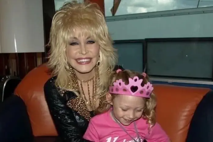 Dolly Parton with Steve Guest\\'s daughter, Gracie. Photo: Supplied