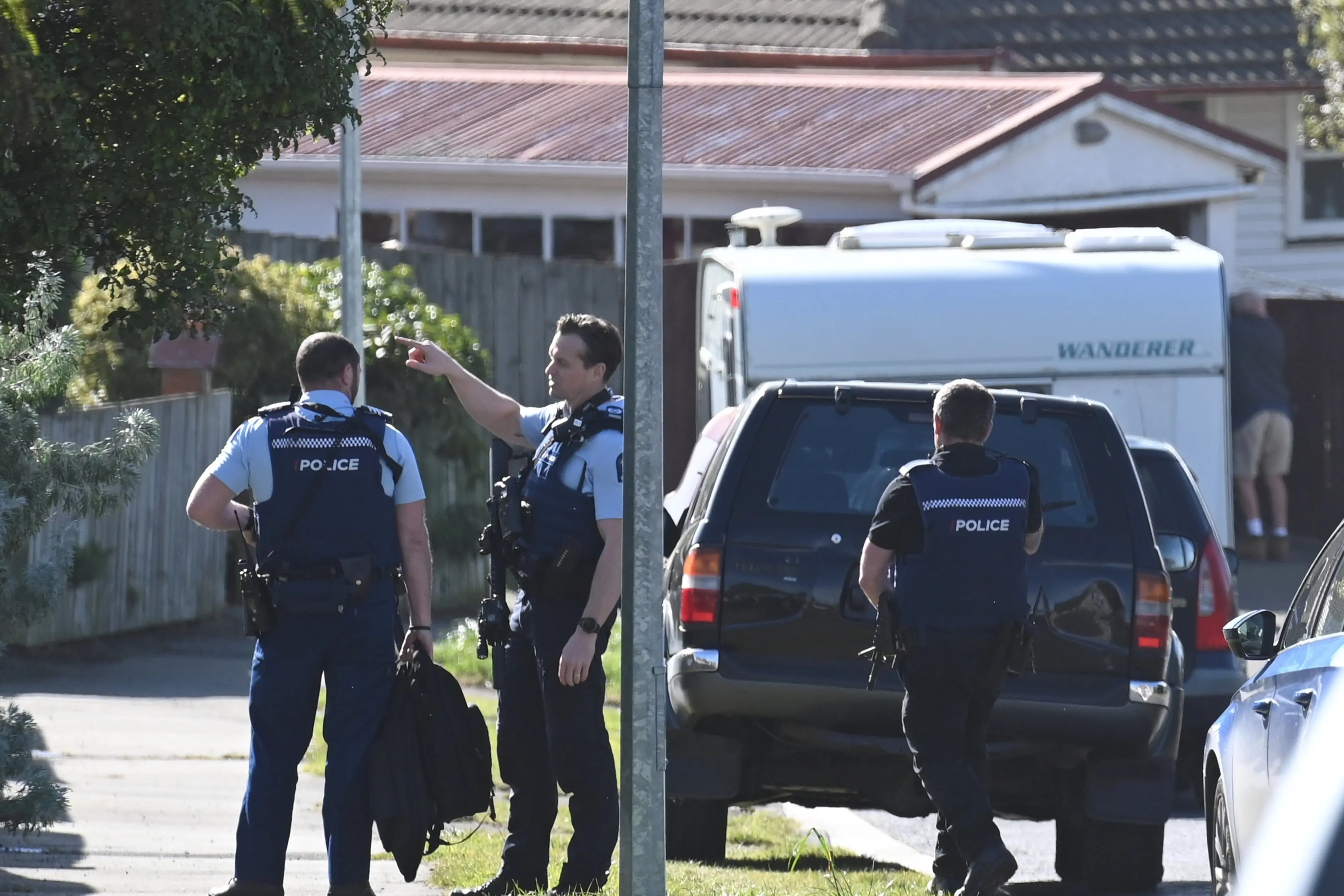 Armed police and police dogs attend an incident in Dovecote Ave, Corstorphine on Tuesday. Photo: Staff photographer