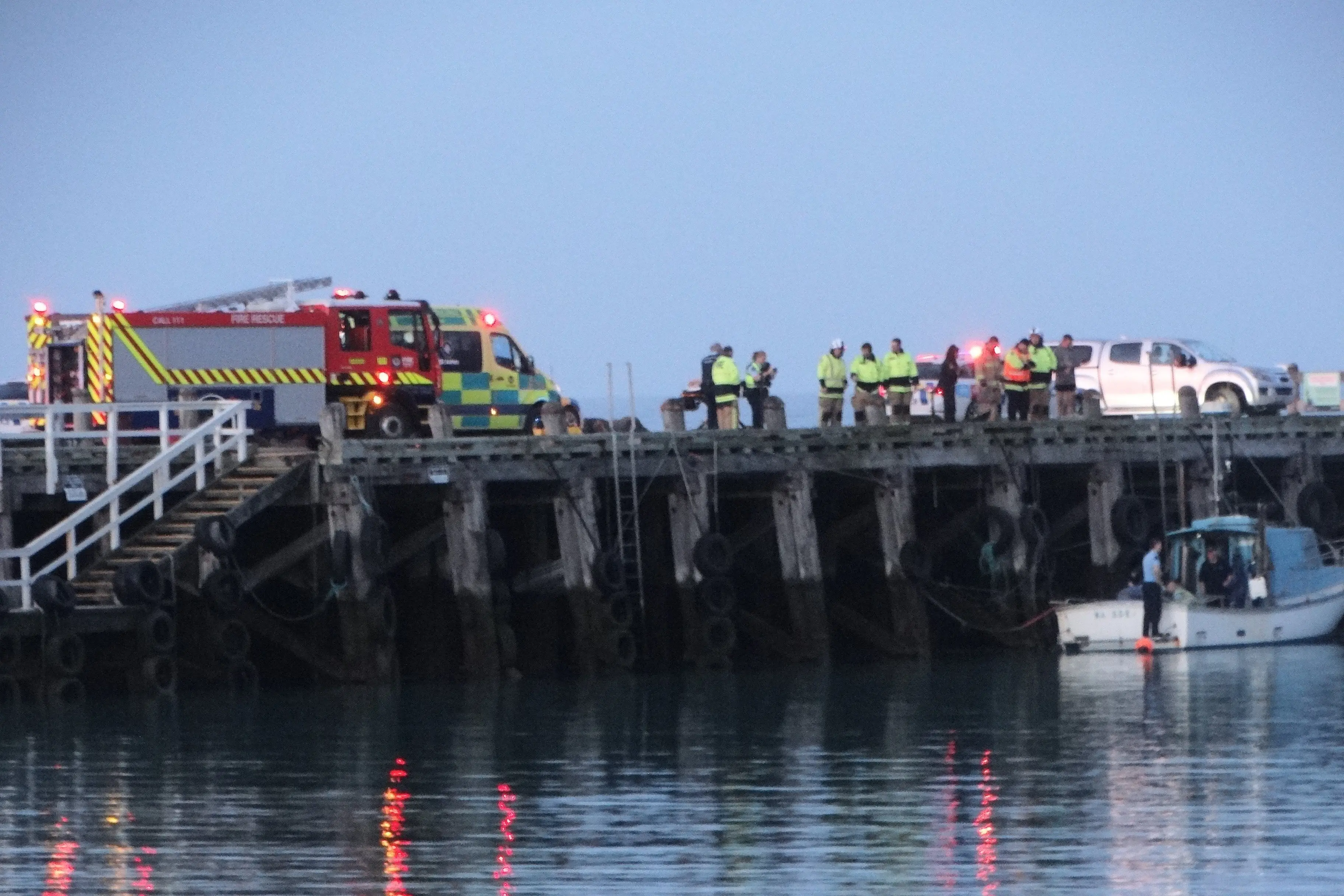Emergency services on Holmes Wharf in Oamaru on Tuesday. Photo: Nic Duff