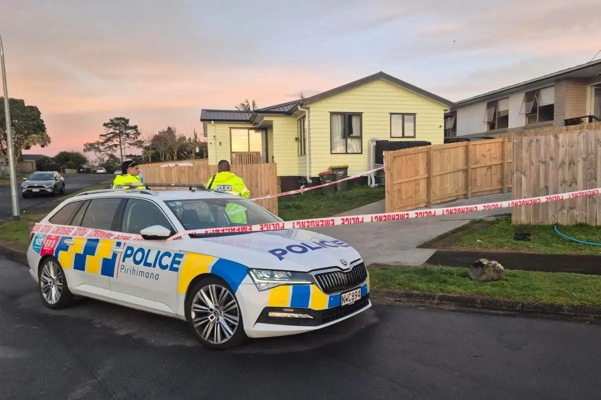 Police remain at the scene of a suspected double homicide in South Auckland\\'s Wattle Downs on Friday. Photo: RNZ