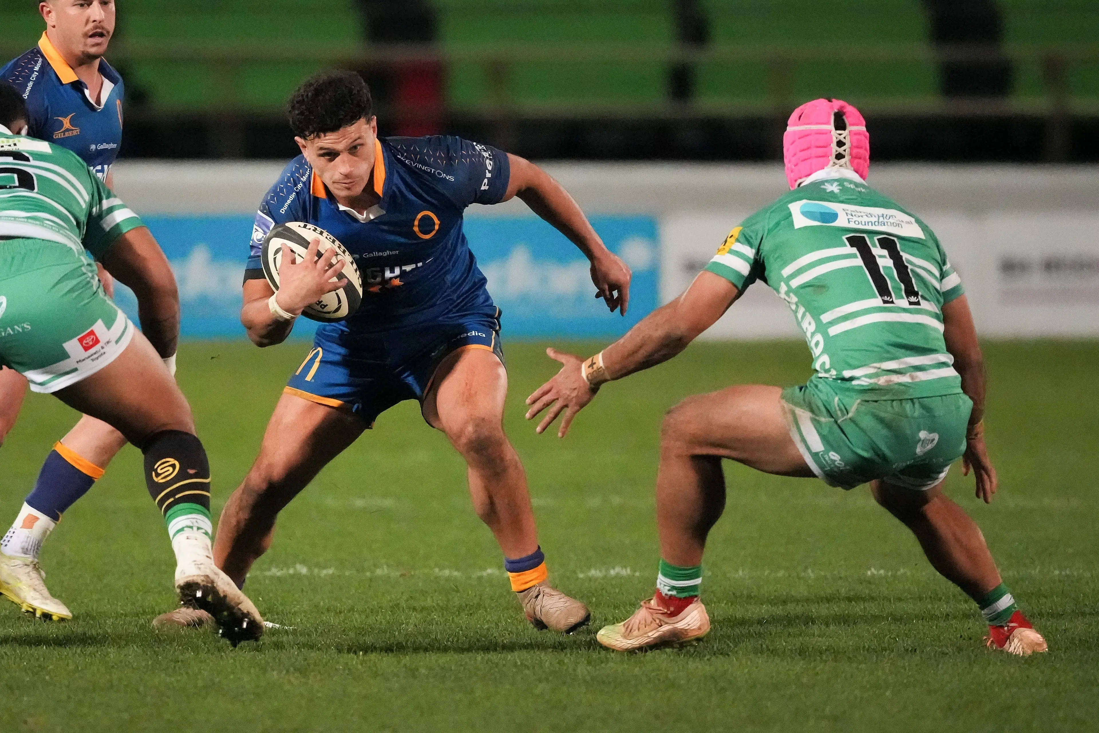 Otago midfielder Jake Te Hiwi looks for a way past Manawat\\u016B defenders TK Howden (left) and John Tapueluelu in Palmerston North earlier this month. Photo: NZ Rugby/Smartframe