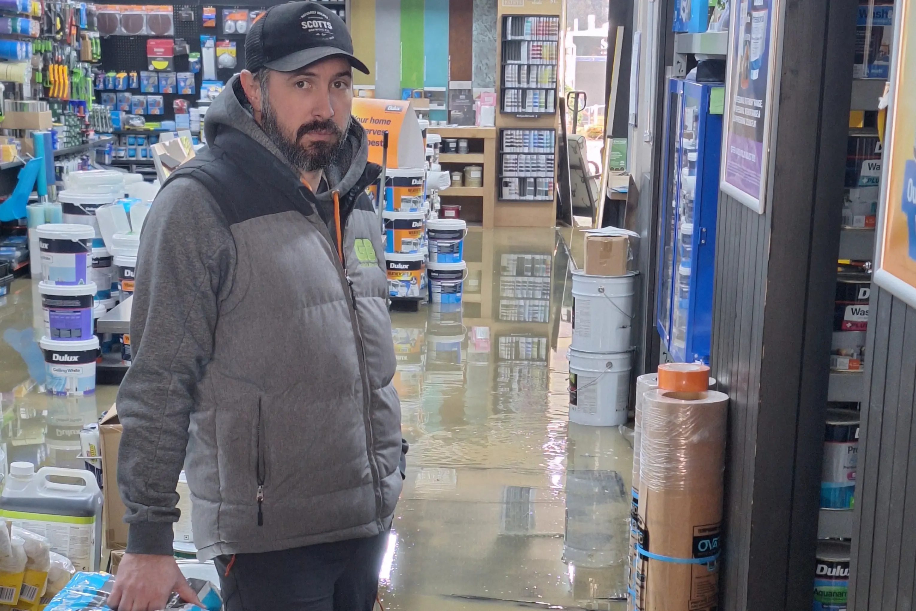 Inundated: Guthrie Bowron Queenstown owner Thomas McWilliam is facing tens of thousands of dollars of damage to his store from flooding overnight on Thursday. Photo: Guy Williams