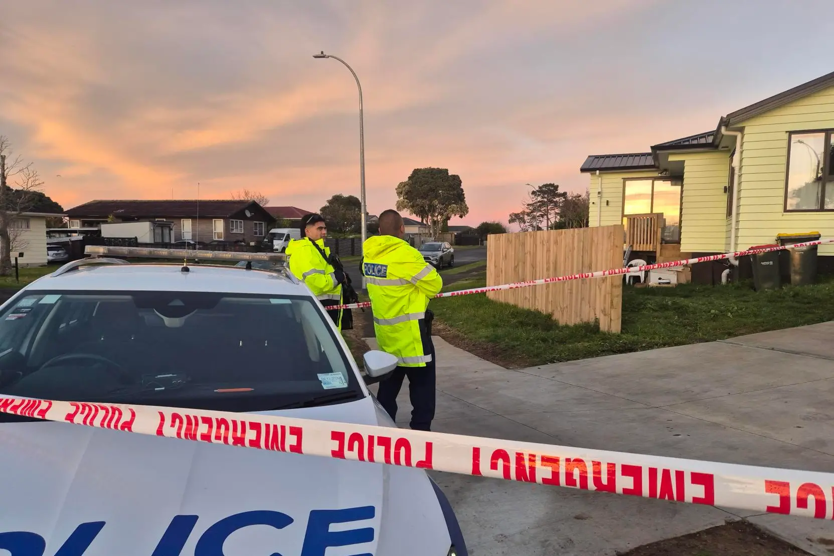 Police remain at the scene of a suspected double homicide in South Auckland\\'s Wattle Downs on Friday morning. Photo: RNZ / Jessica Hopkins