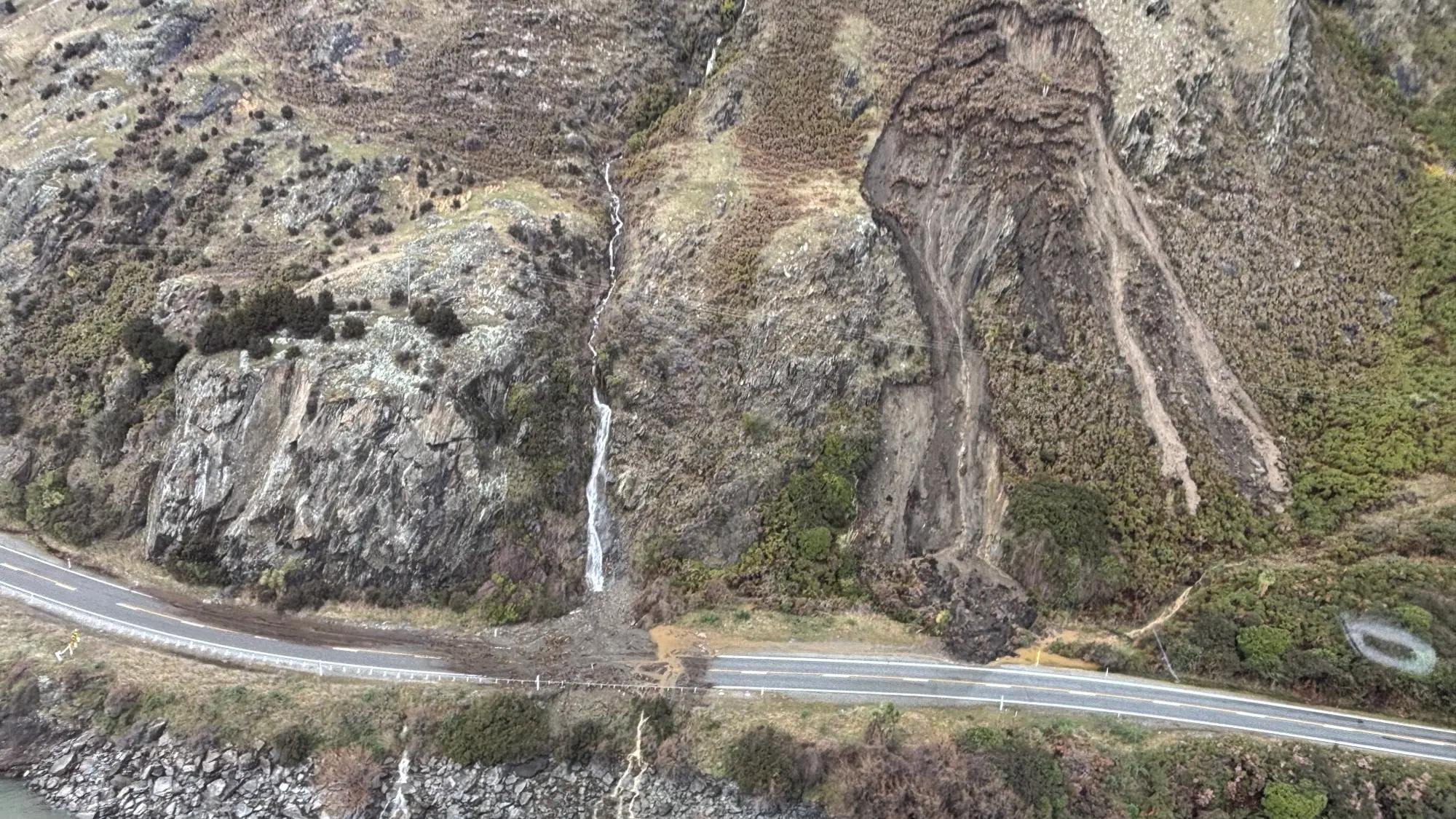 Dramatic photos show slips blocking southern highway