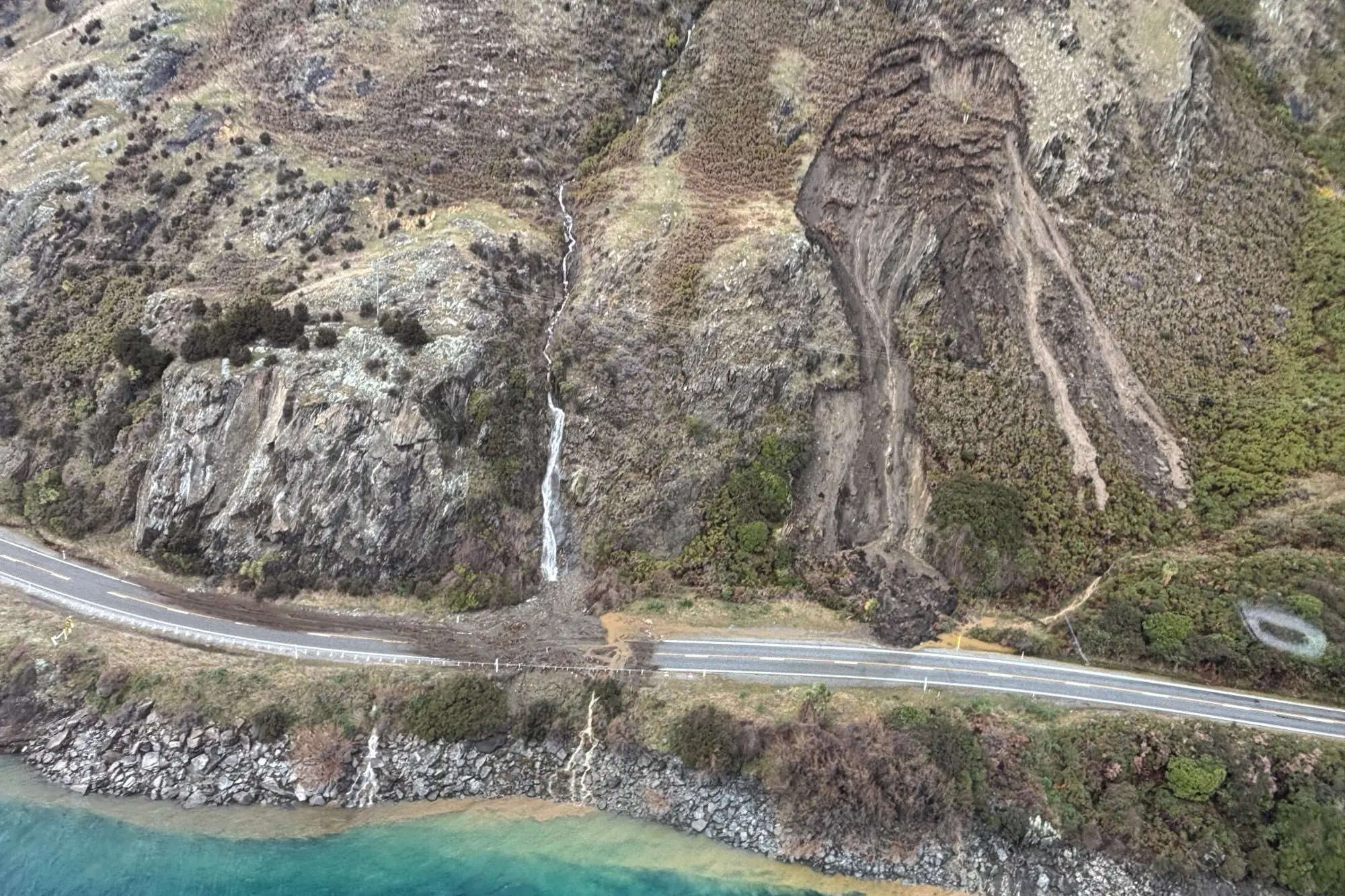 Dramatic photos show slips blocking southern highway