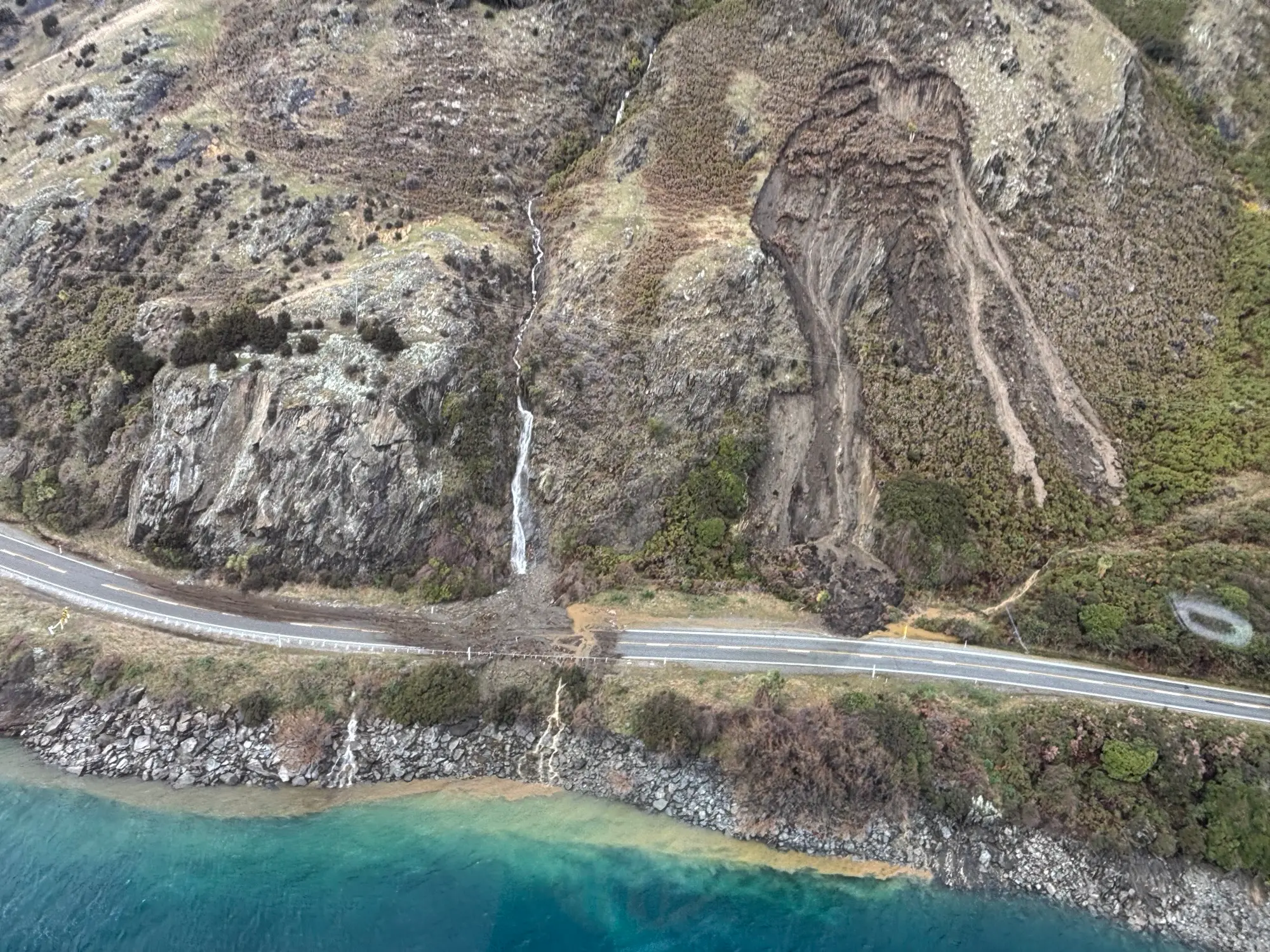 Dramatic photos show slips blocking southern highway