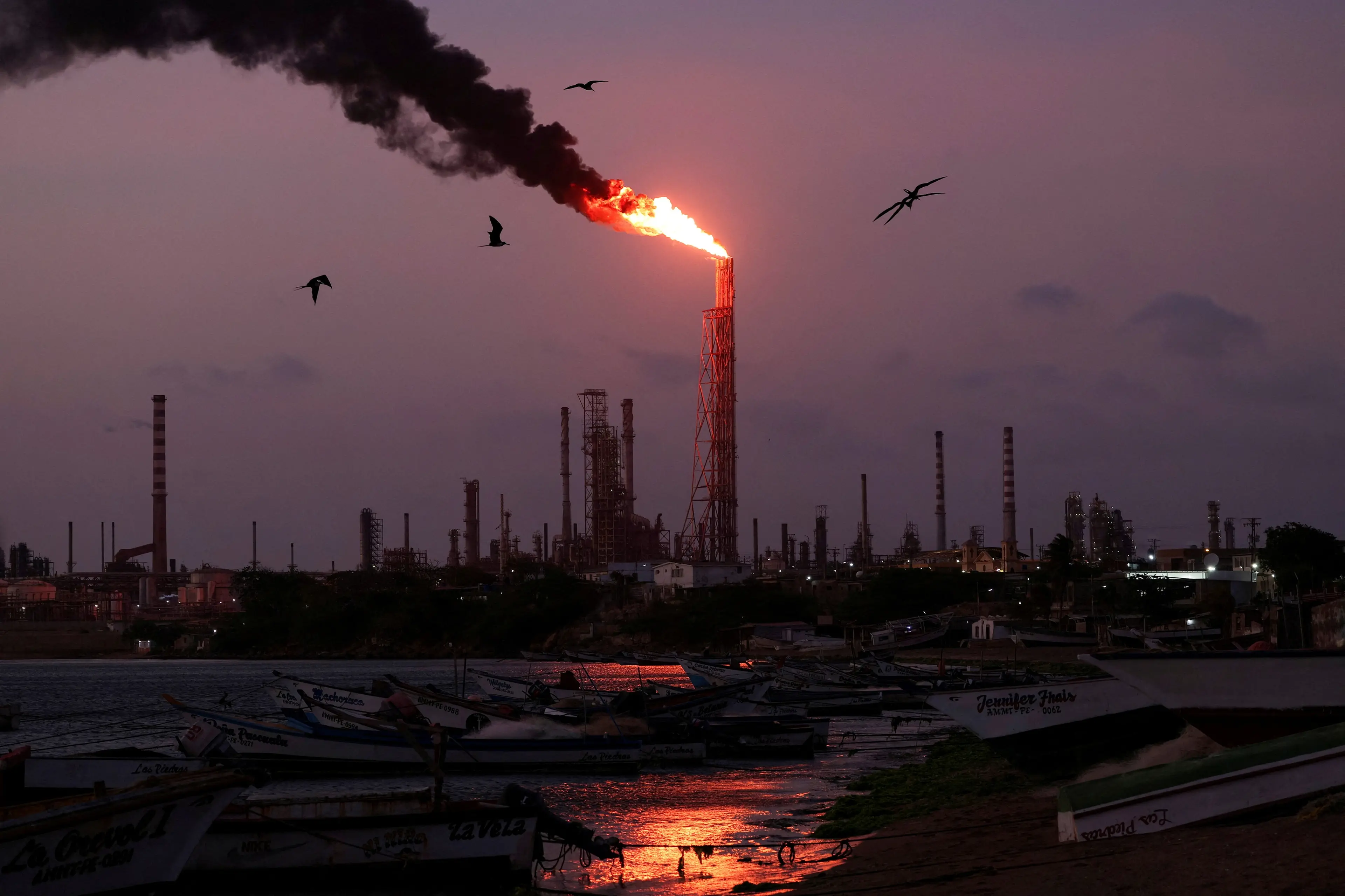 <p>A gas flare burns at the Cardon refinery, part of the Paraguana Refining Center, in Punta Cardon, Venezuela. Photo: Reuters</p>\\n