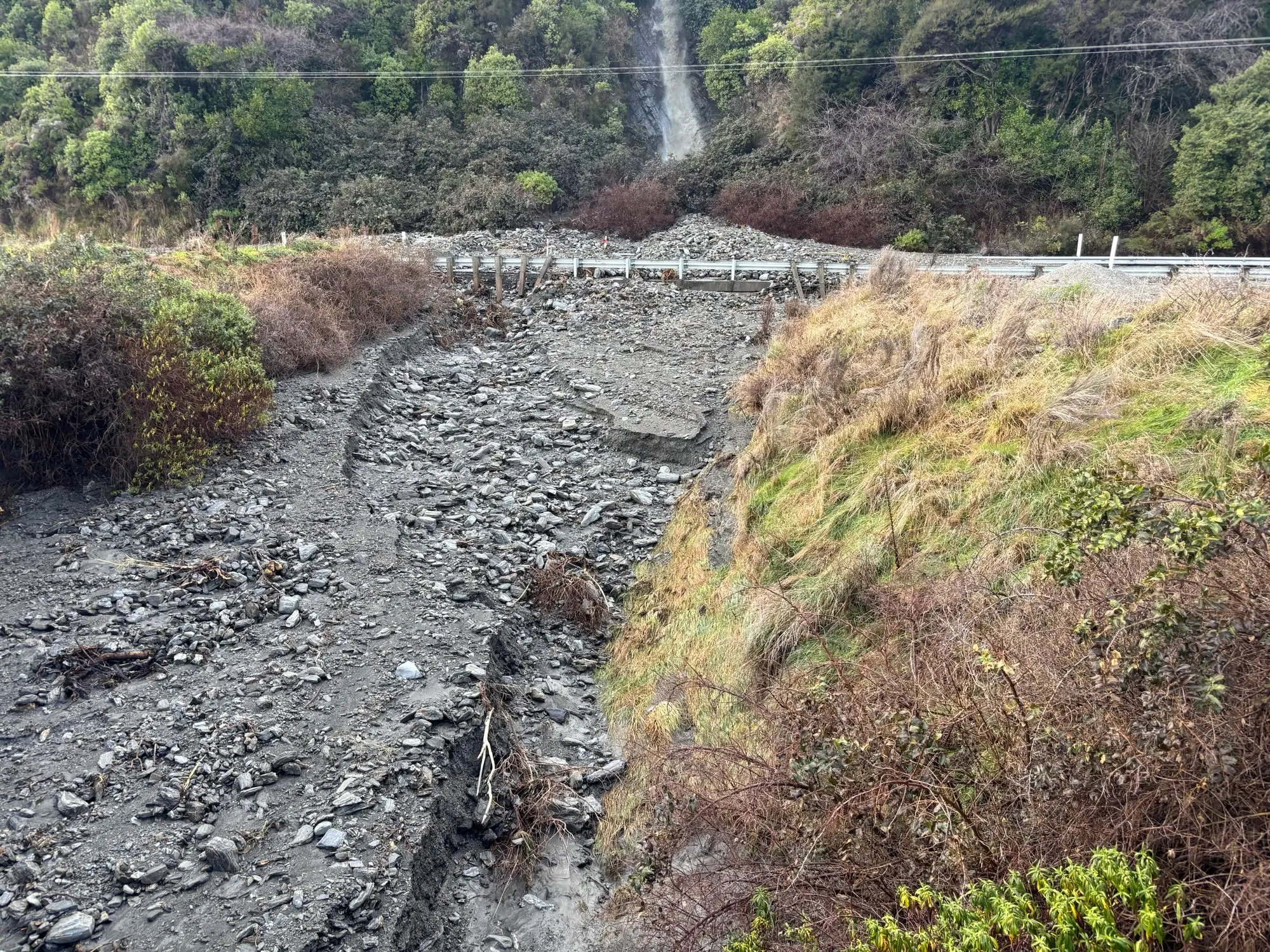 Crews working to clear 30 slips on closed section of SH6