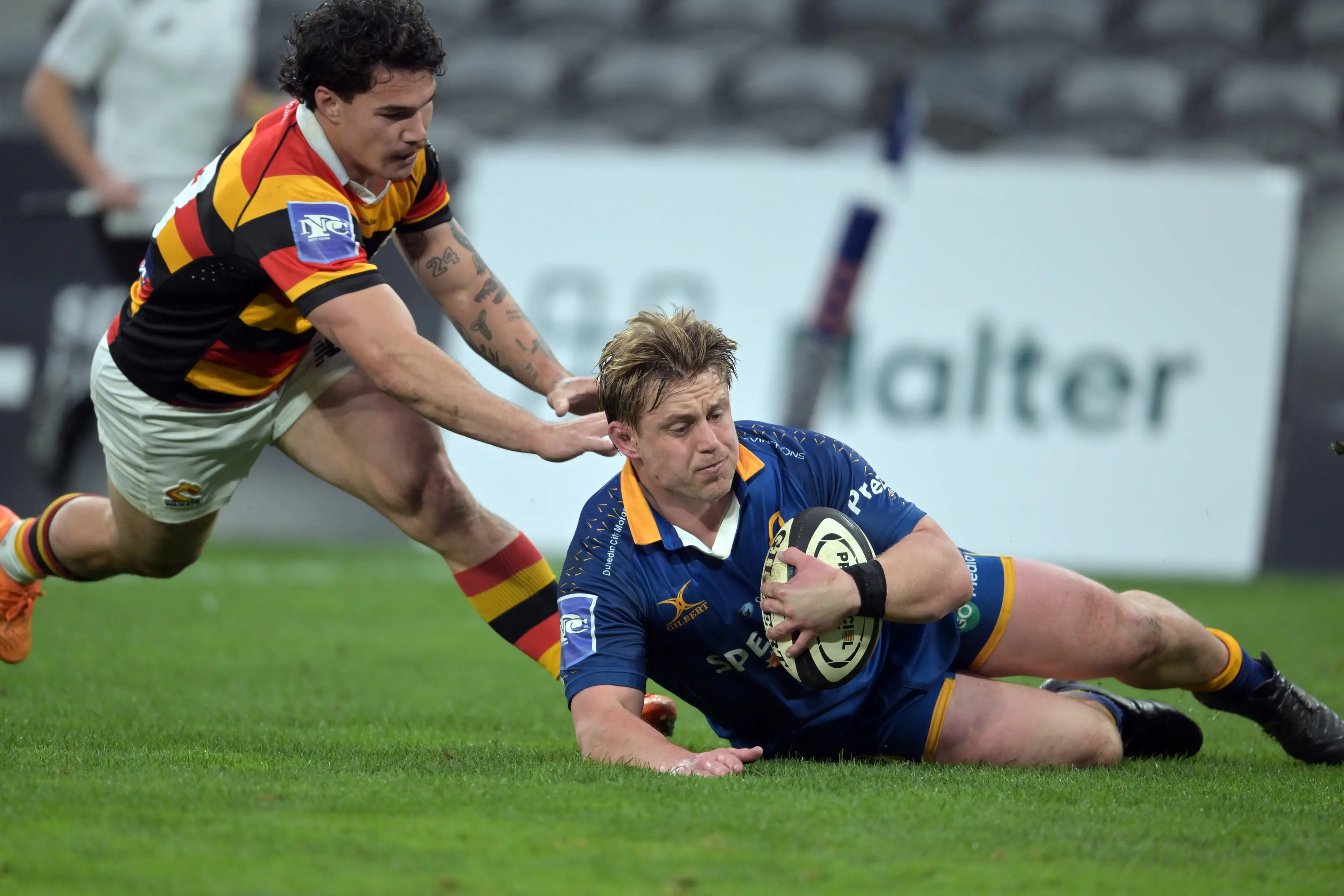 Otago hooker Henry Bell runs in for a second try ahead of Waikato defender Tepaea Cook-Savage during the NPC game at Forsyth Barr Stadium on Saturday night. Photo: Gerard O\\'Brien