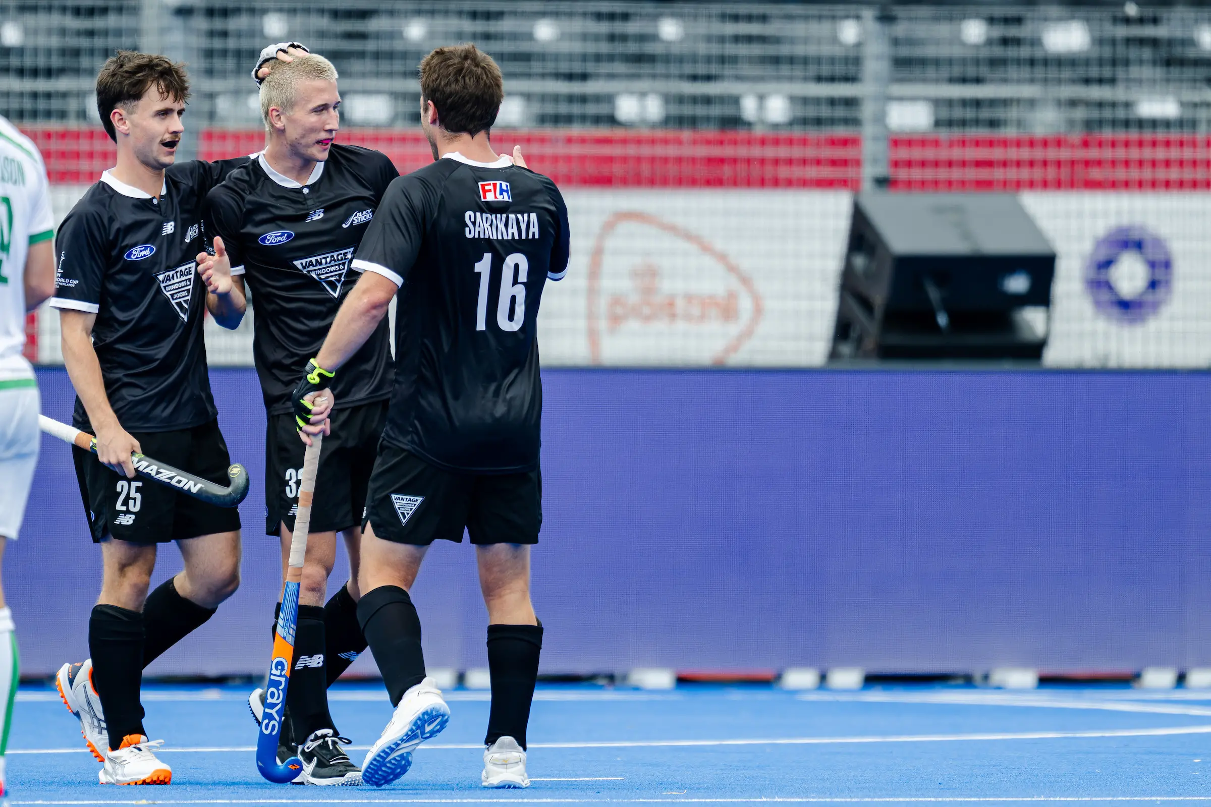 Black Sticks players (from left) Bradley Rothwell, George Baker and Aidan Sarikaya celebrate a goal during New Zealand\\'s 6-3 win over Ireland in the playoff for ninth place at the Hockey World Cup in Belgium. Photo: Worldsportpics