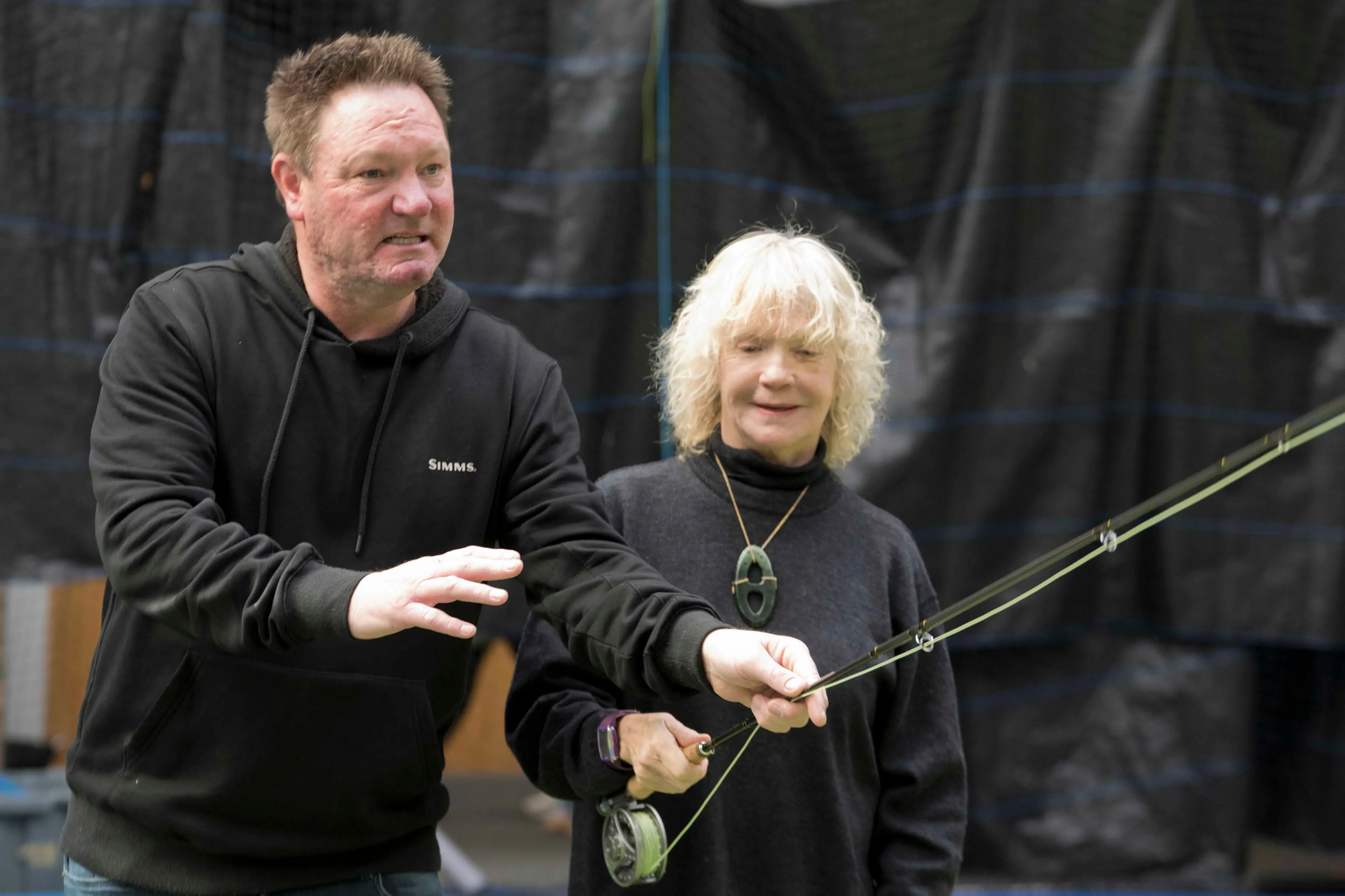Professional fly fishing guide Chris Dore helps learner angler Di Vickers, of Dunedin, with her technique yesterday. Photo: Gerard O\\'Brien