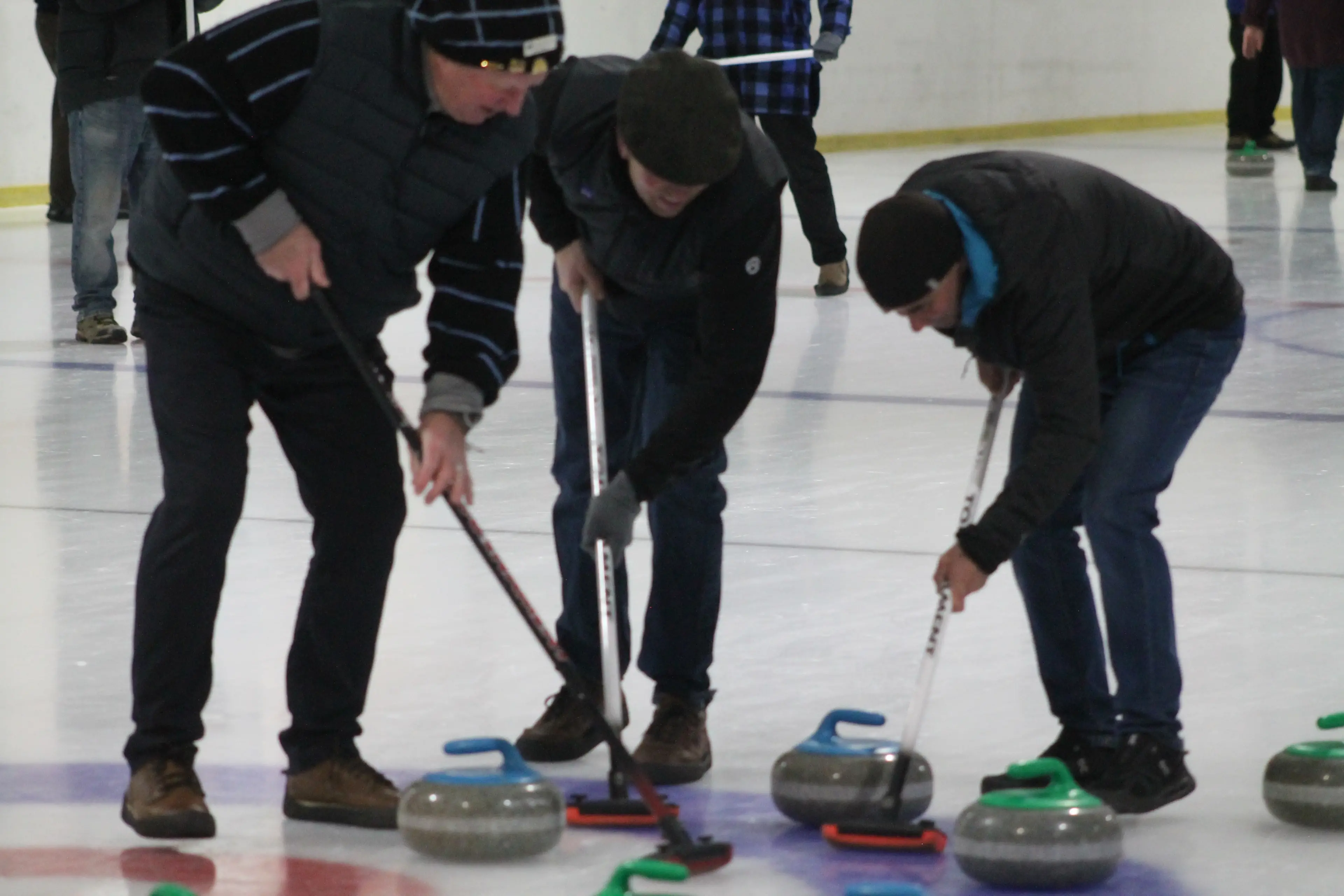 The Cardrona Curling Club competed for a clean sweep at a curling tournament in Gore, as W\\u0101naka player Will O\\'Neill (left) worked with Gore District locals Fred Milford-Cottam (centre) and Craig Barkley, who were filling in for an injured player. Photo: Gerrit Doppenberg.