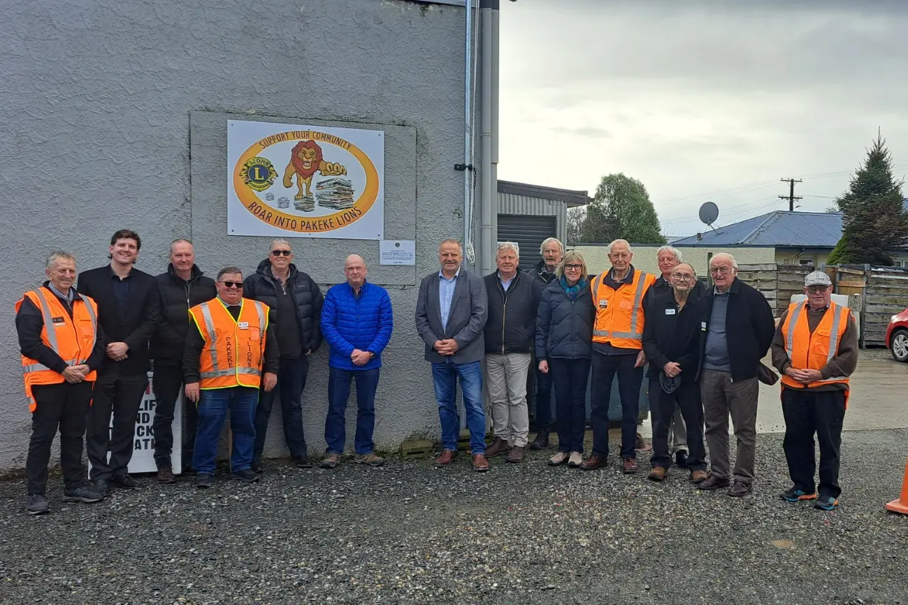 Members of the Pakeke Lions alongside Gore Mayor Ben Bell and the McPhail and McKay families celebrate the legacies of three foundational members - Neil McPhail, Vic Taylor, and Don McKay - as they unveiled a plaque at the cardboard factory the three worked to create two decades ago. Photo: Gerrit Doppenberg