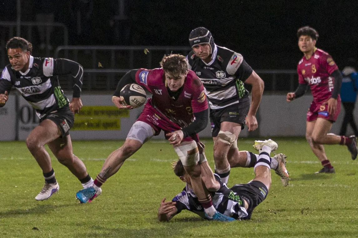 Southland left wing Michael Manson attempts to evade the tackle of Hawke\\'s Bay replacement halfback Connor McLeod. PHOTOS: DARRYL WINTER PHOTOGRAPHY