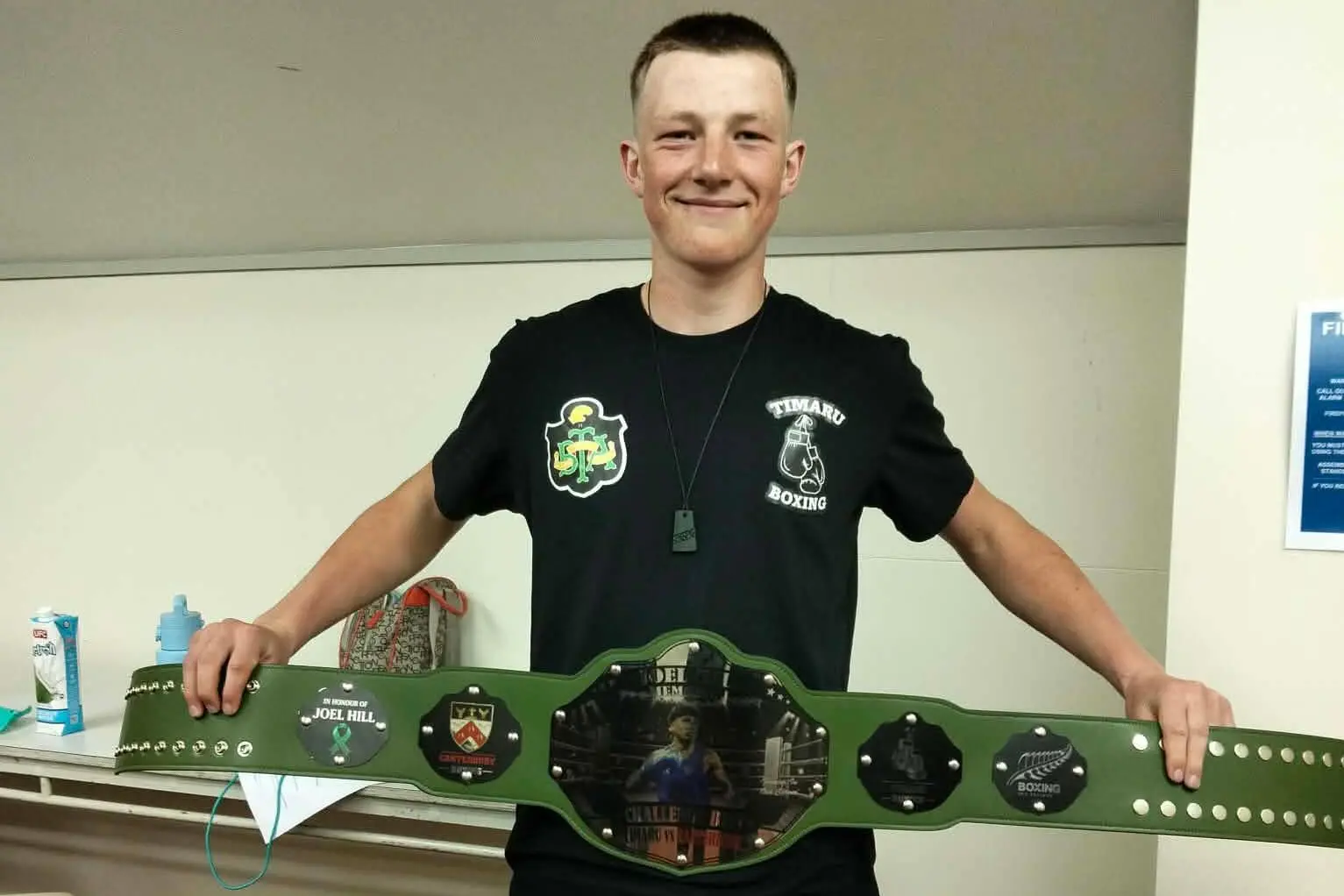 William Crooks celebrates with the Joel Hill Memorial belt after defeating Woolston\\'s Thomas Sutherland. Photo: Supplied