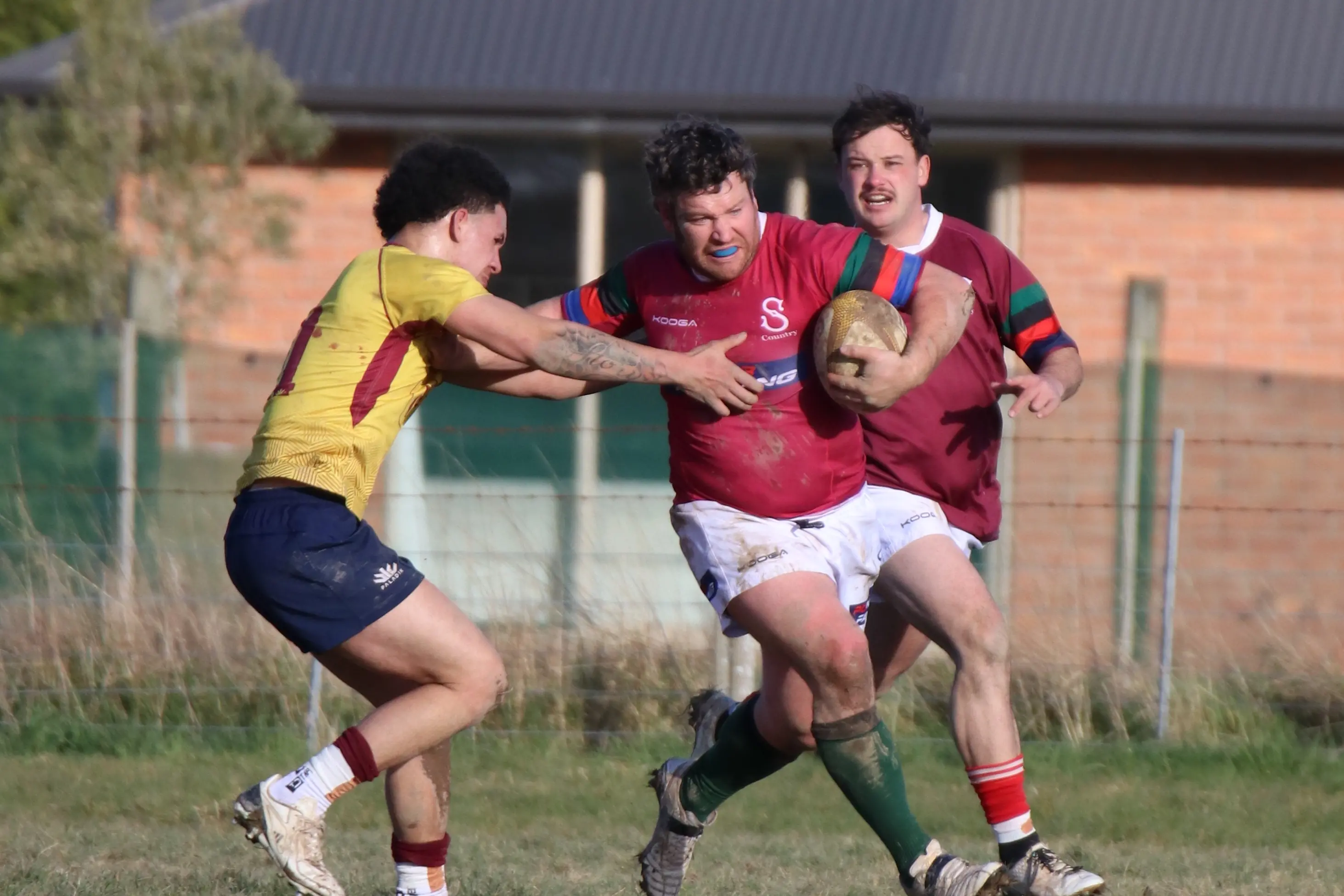 Southland Country player Keiran Short has Rylee Stewart in support as he fends off an Otago Country player during a game between the two sides on Saturday in Mataura. It was the teams\\' last game in the Tuppy Diack series contested by Otago and Southland metro and country sides. Photo Emma Templeton Photography.