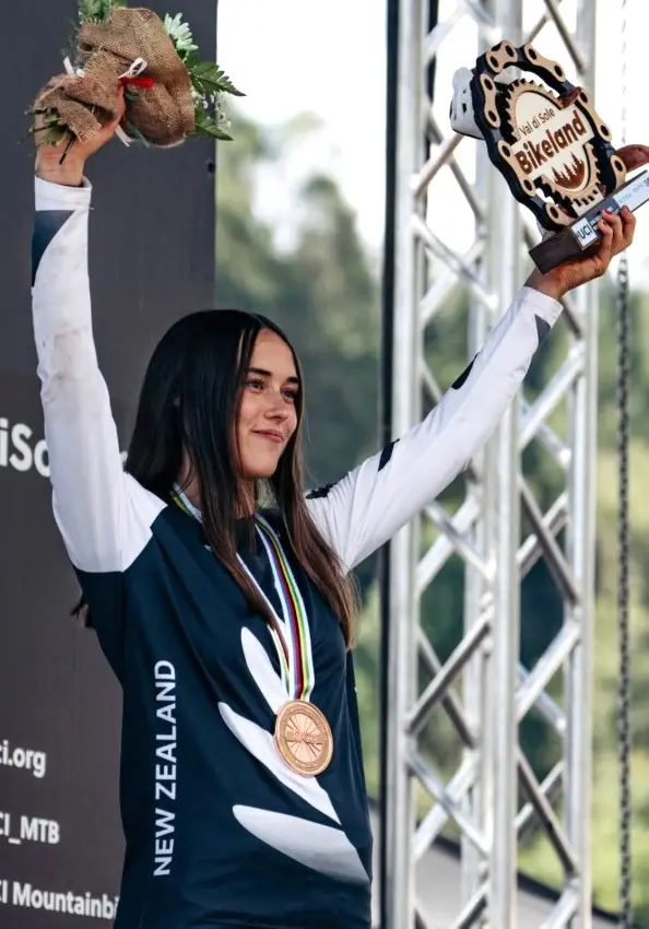 On the rise: Indy Deavoll celebrates her bronze medal in Val di Sole, Italy. Photo: Monica Gasbichler