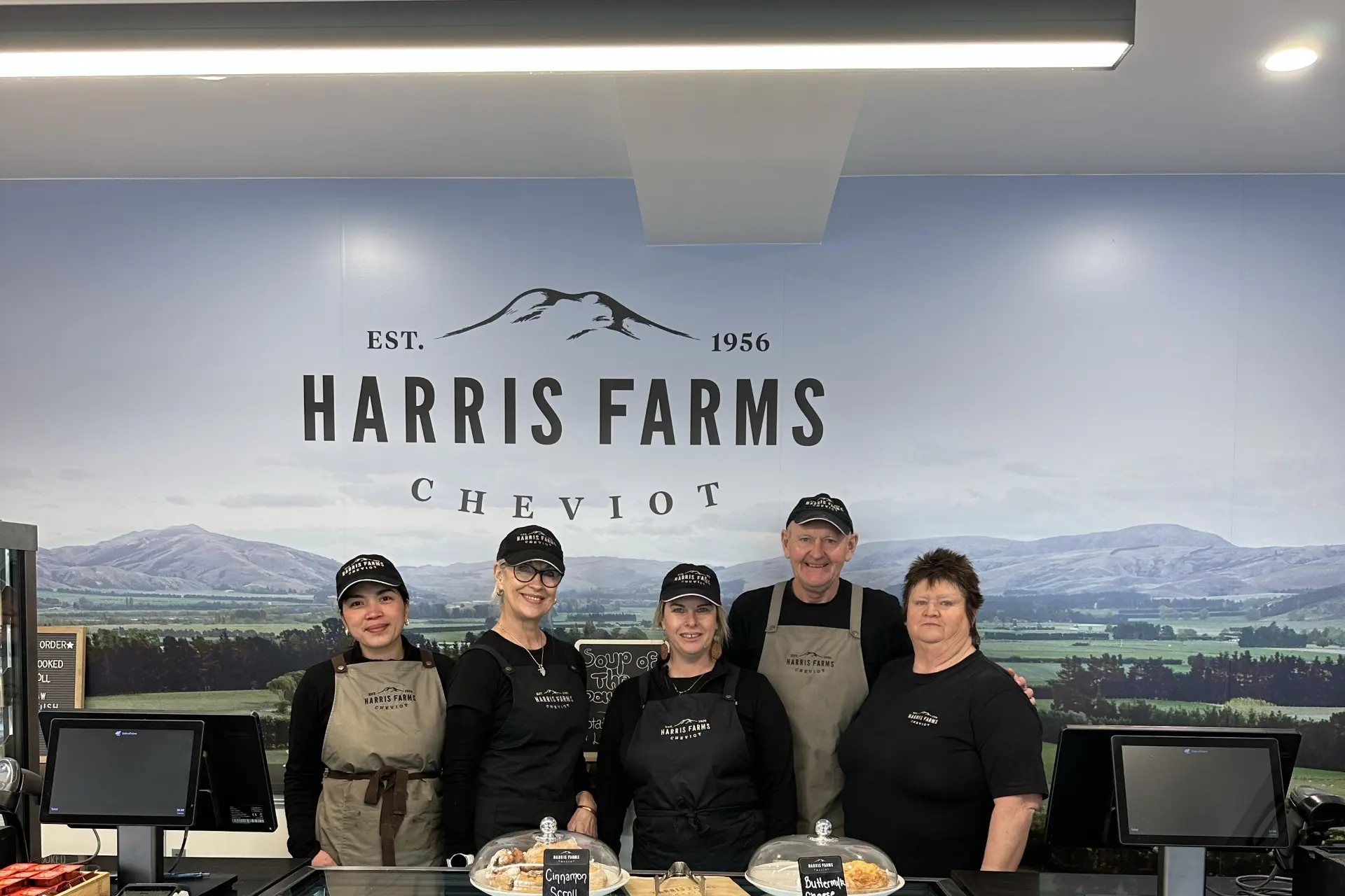 Harris Farms . . . The shop staff at Harris Farms Bakery & Cafe alongside its iconic butcher\\'s shop. Photo: Supplied