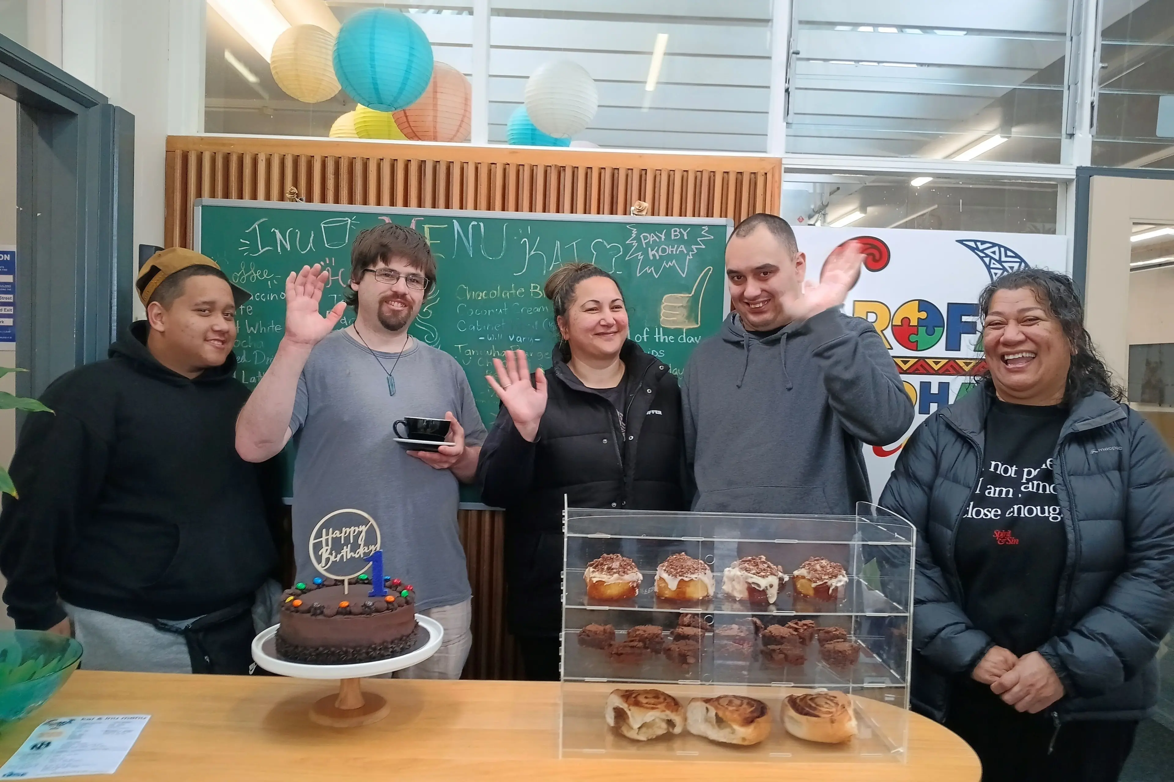 Arofa Koha Cafe celebrated its first anniversary last week with the community over coffee and cake. Celebrating were, from left, Kumai, Rowan, trustee Sapphire Stanley, Aidan and co-founder Celia Colcord. Photo: Toni Williams