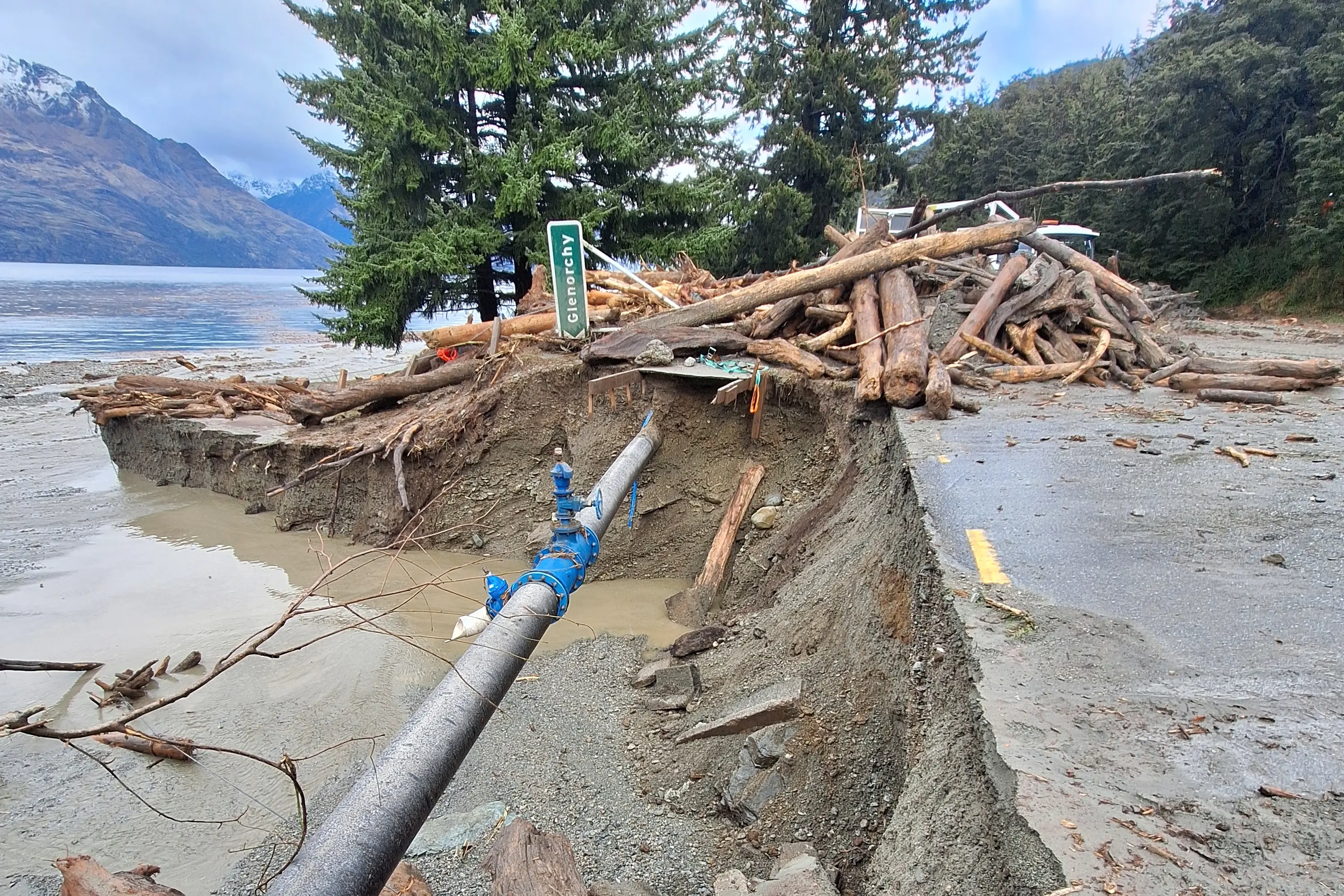 Aftermath: Part of the footpath and a bridge were washed out by Queenstown\\'s One Mile Creek last week following unrelenting torrential rain - and more is forecast. Photo: Guy Williams