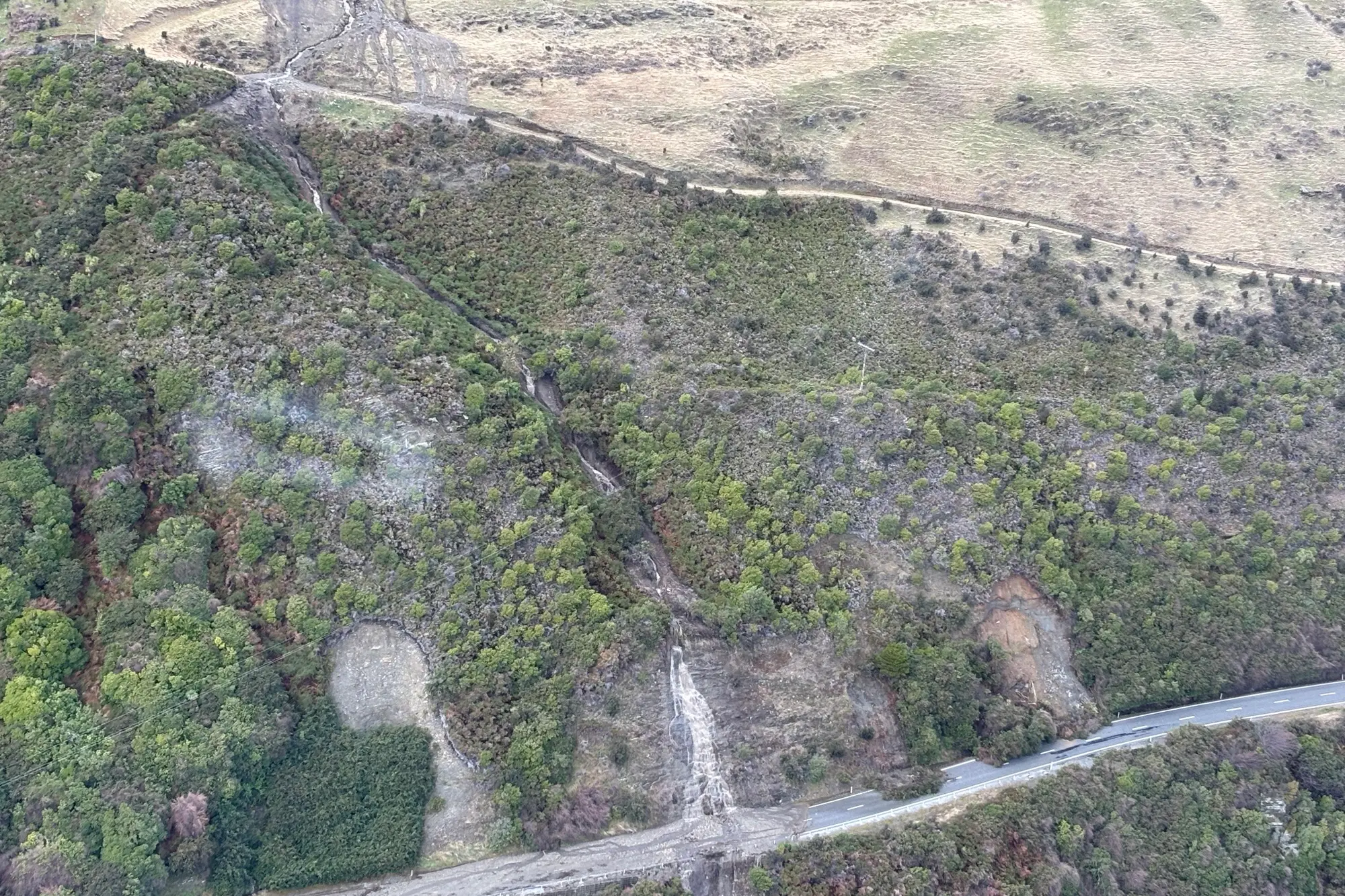 After days of wet weather approximately 30 slips close State Highway 6 between lake Hawea and Makarora last week. Photo: Supplied